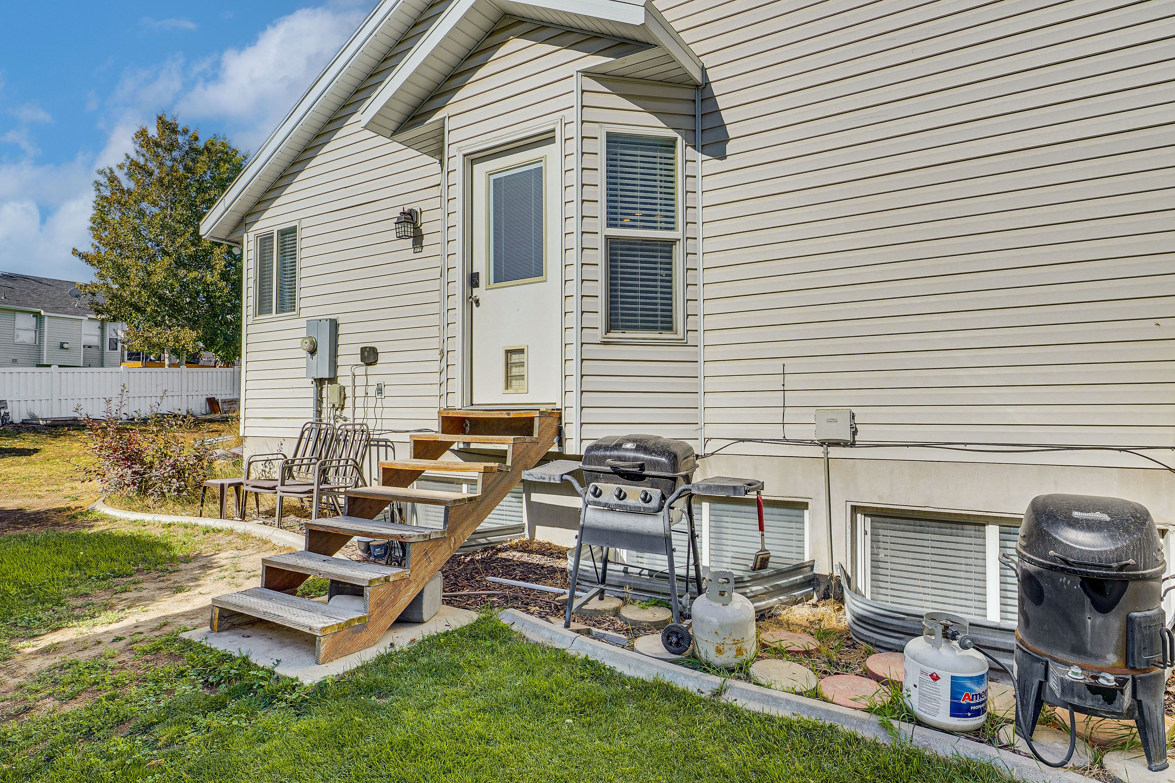 Property Exterior | Fenced-In Backyard | Gas Grill & Smoker