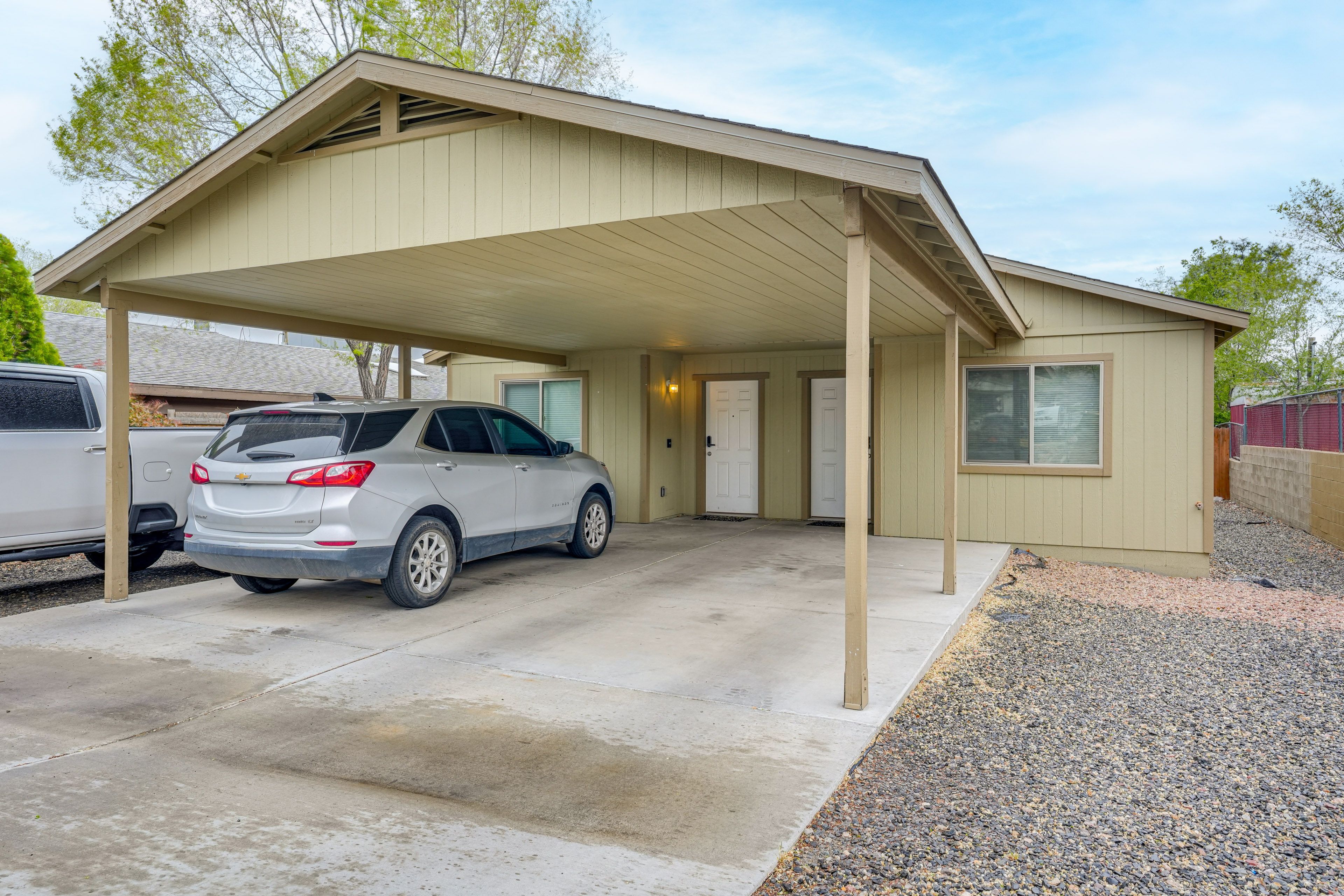 Apartment Exterior | Fenced Backyard