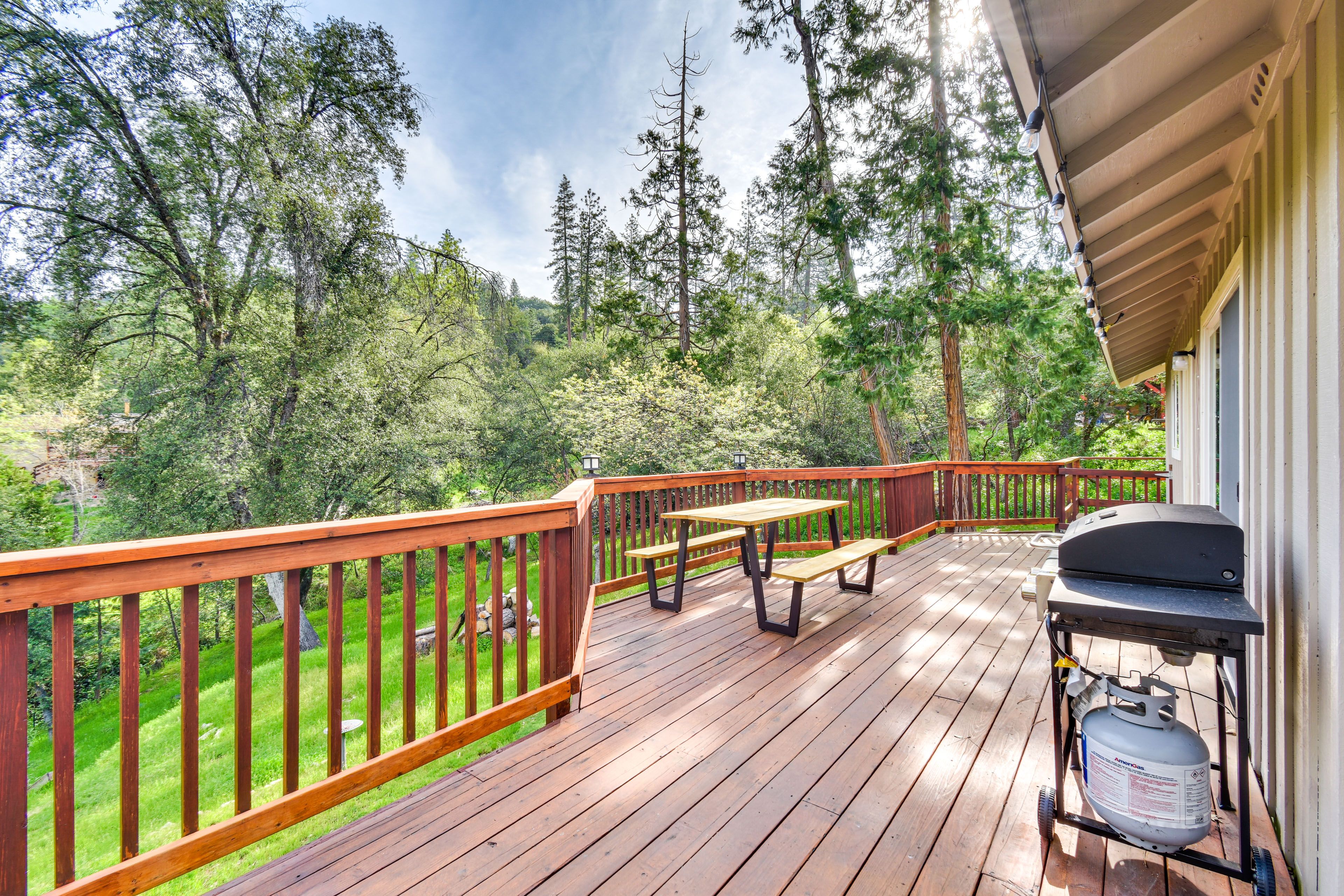 Spacious deck with grill and outdoor seating