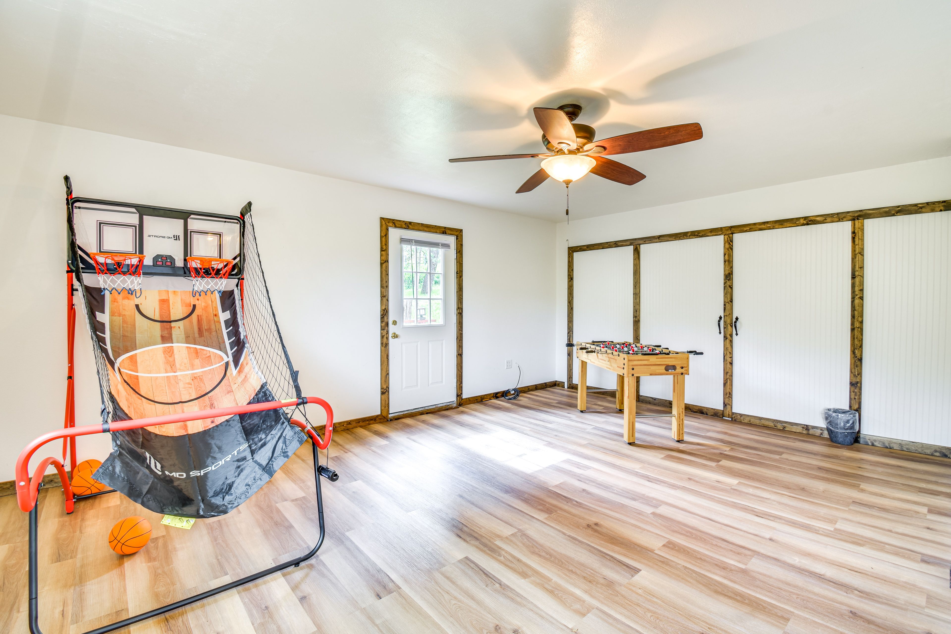 Game room with foosball and basketball game
