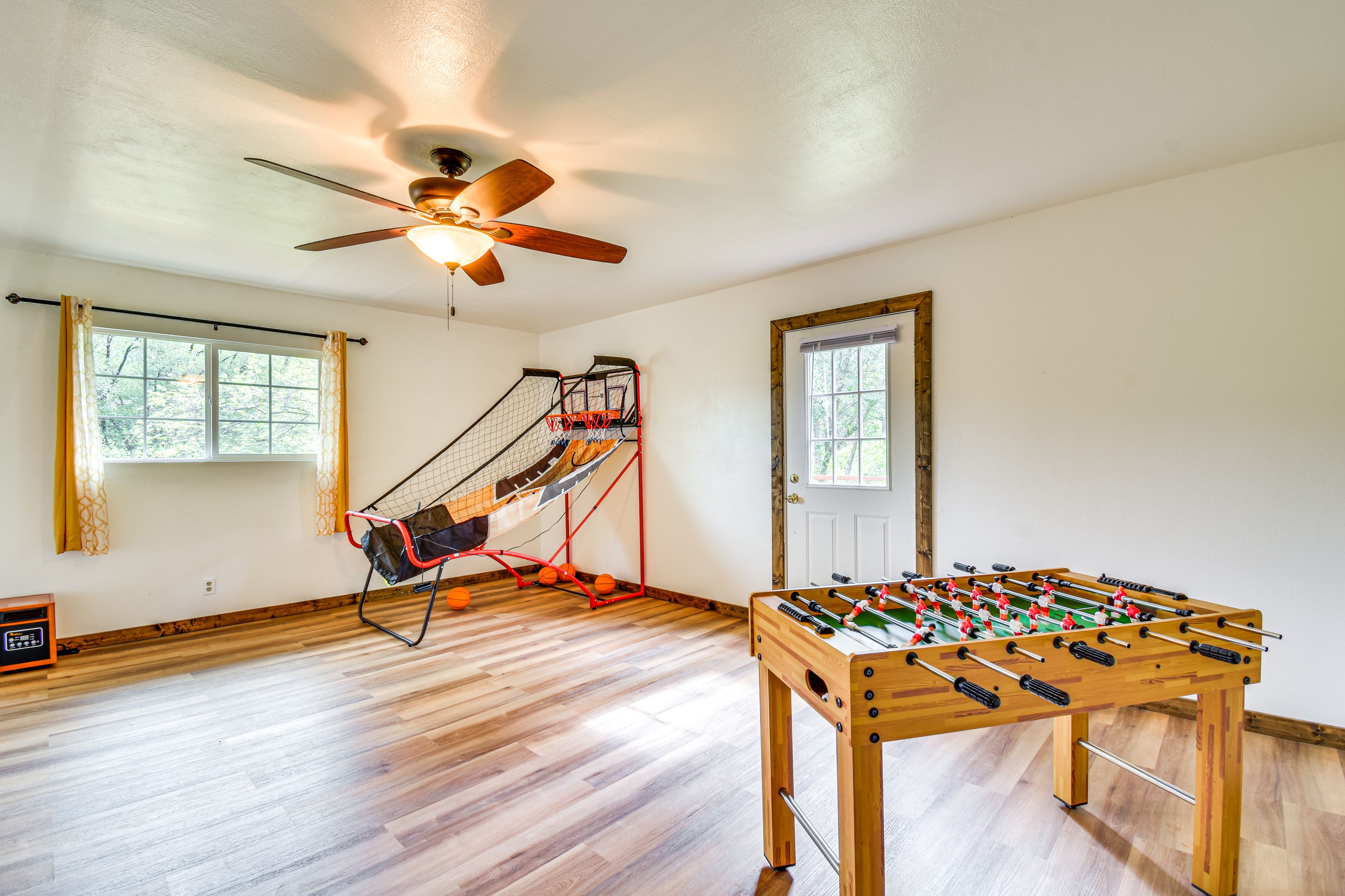 Game room with foosball and basketball game