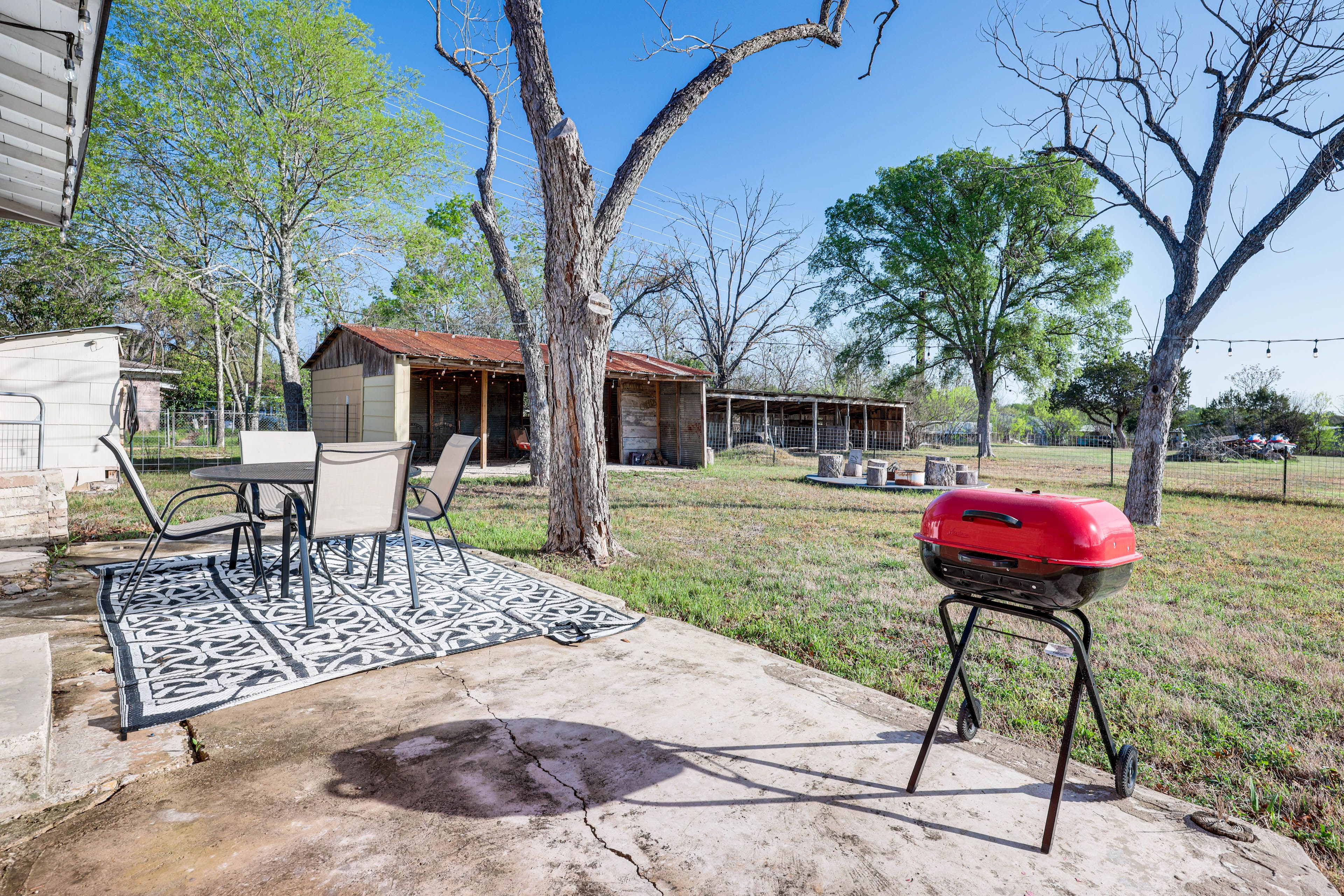 Patio | Fire Pit | Outdoor Dining Areas | Fenced Backyard | String Lights