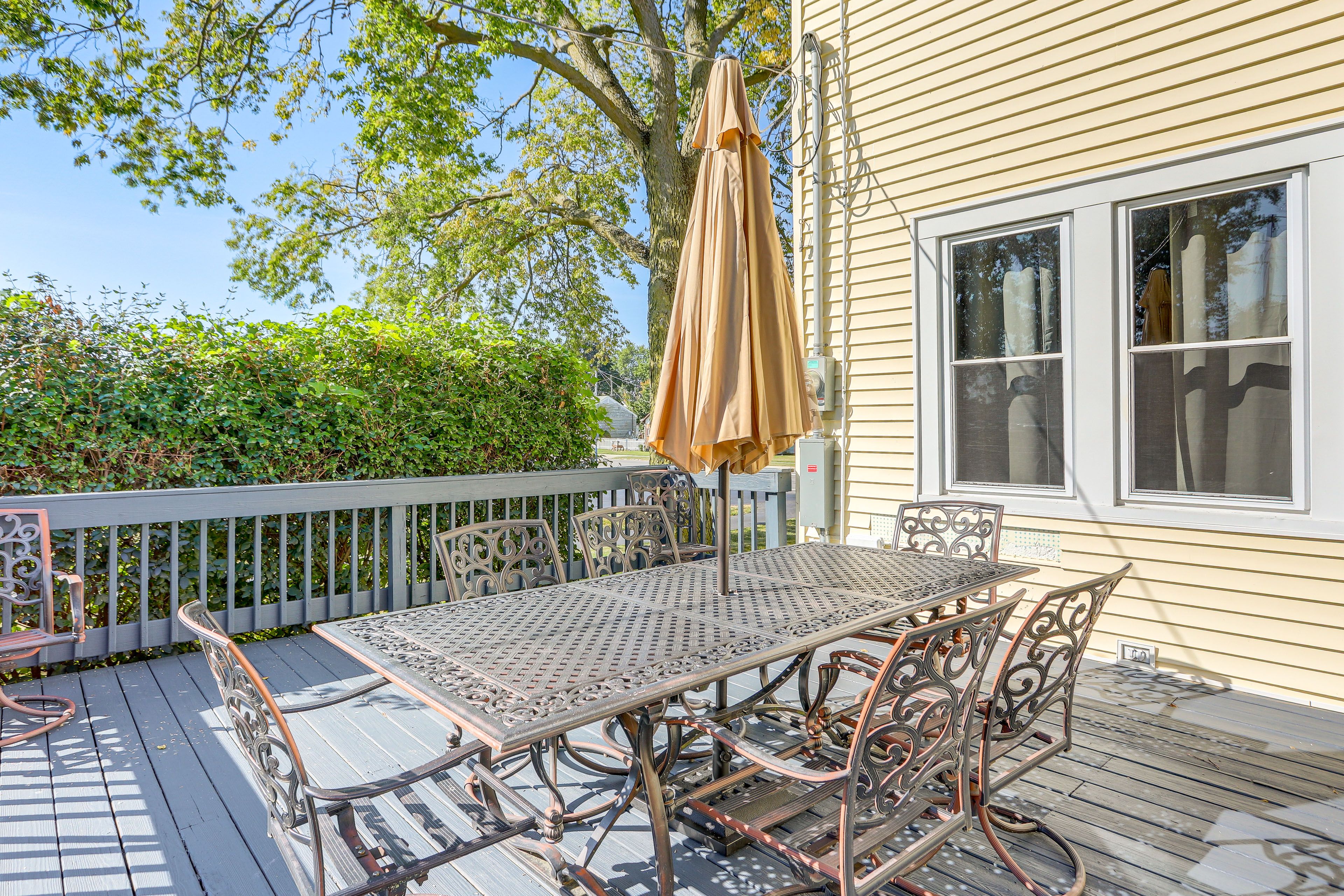 Property Exterior | Deck w/ Dining Table | Spacious Yard | Charcoal Grill
