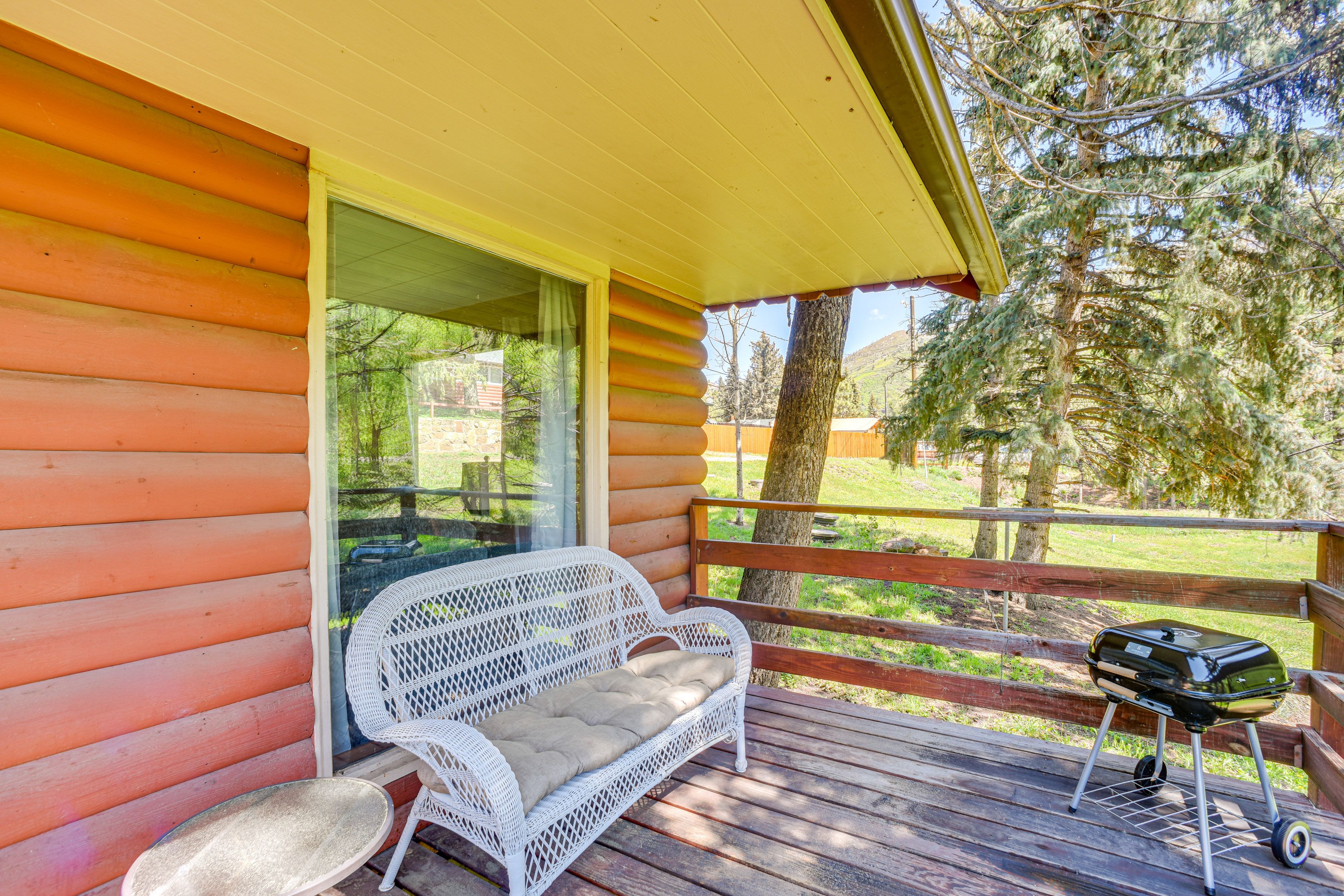 Cabin Exterior | Covered Deck w/ Seating | Charcoal Grill