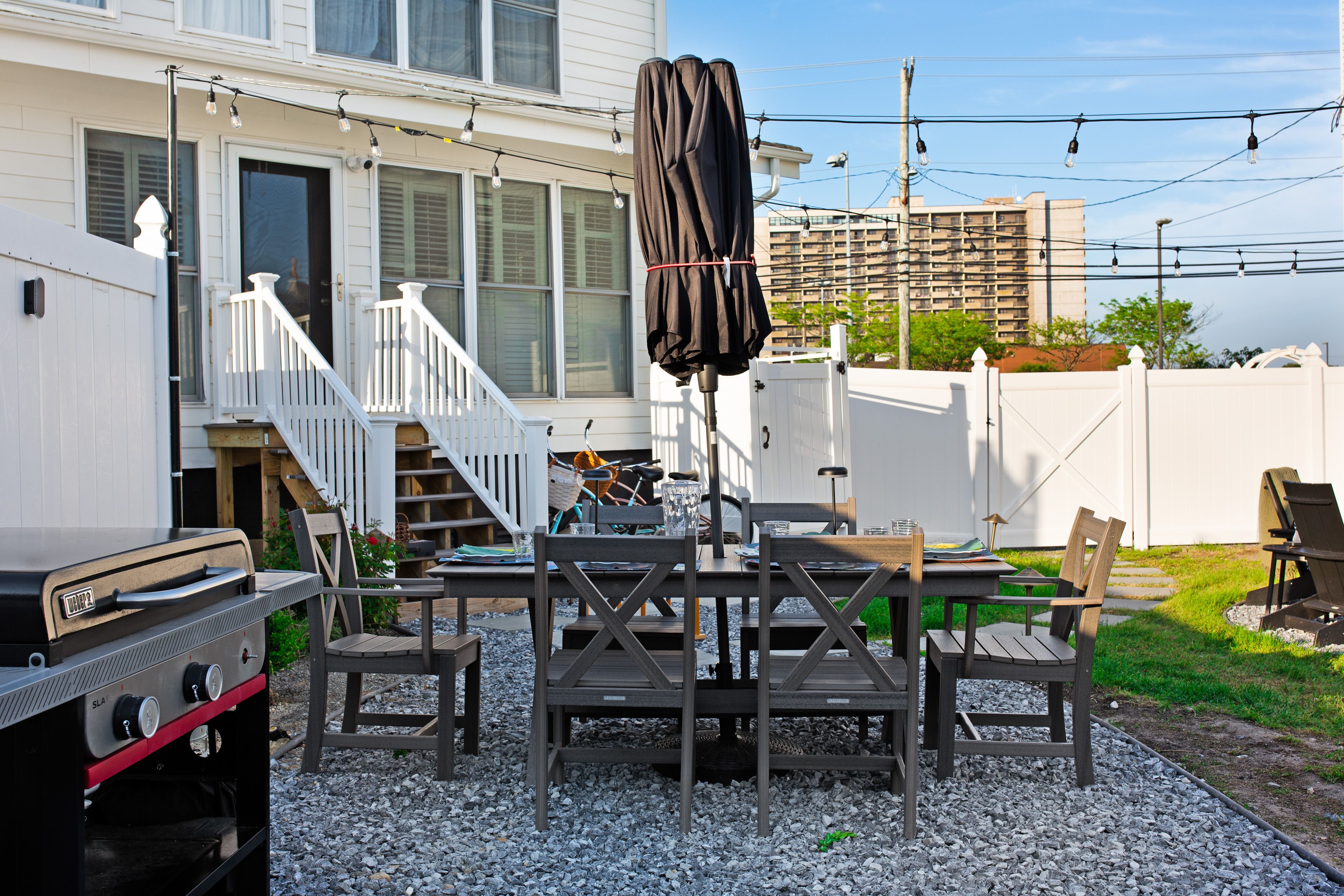 Enjoy al fresco dining with our spacious table and high-end Weber gas grill