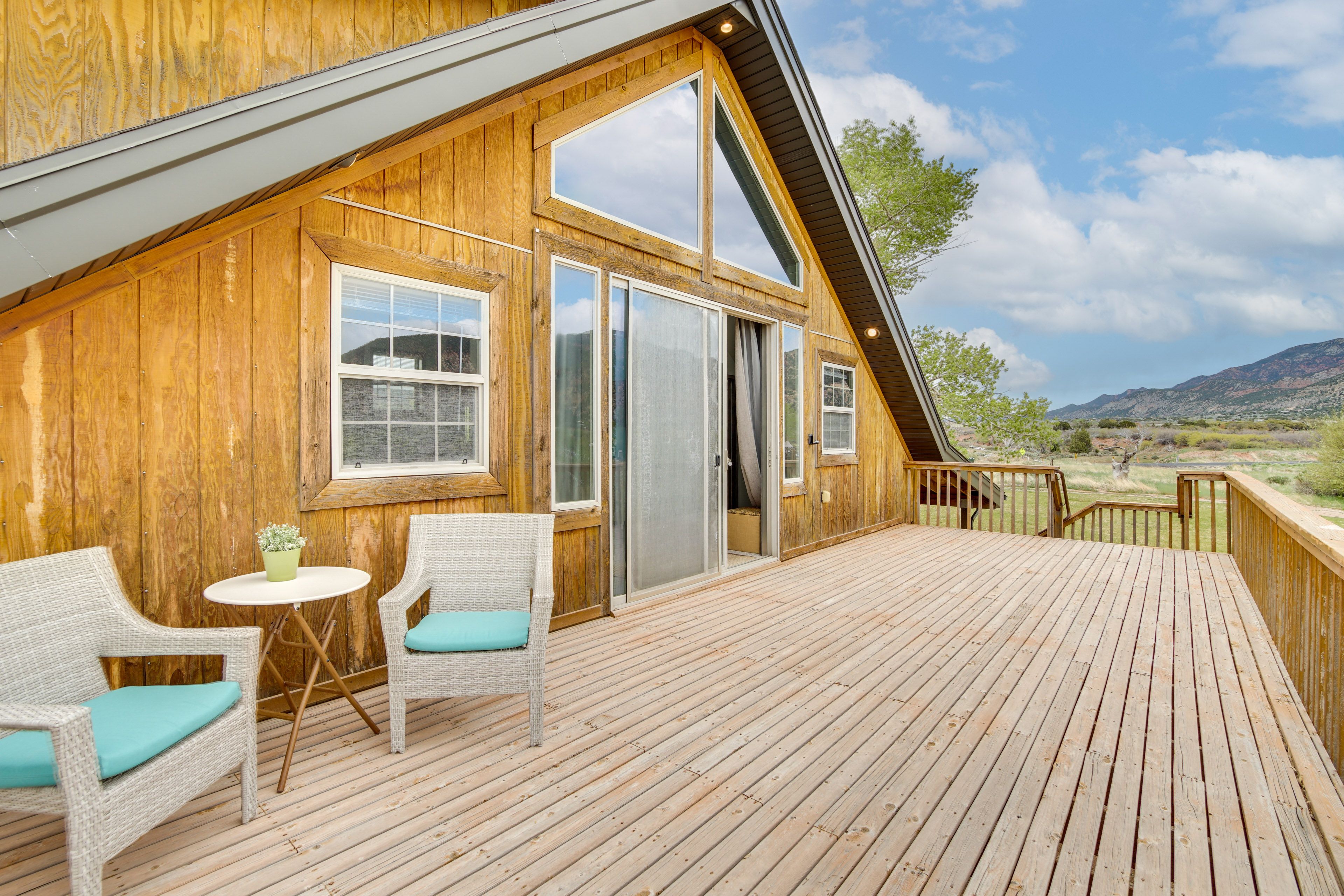 Studio Exterior | Deck w/ Seating | Panoramic Mountain Views