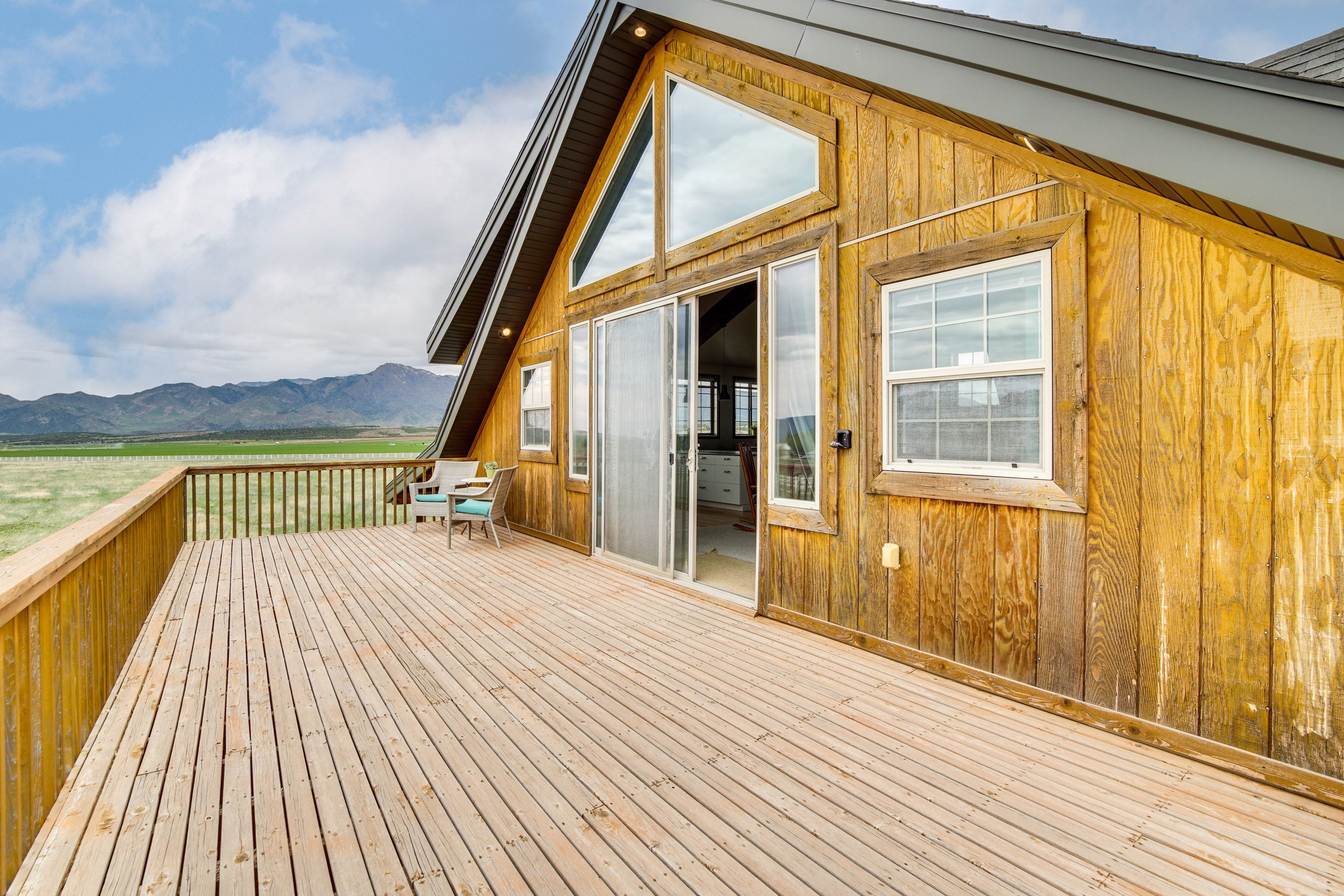 Studio Exterior | Deck w/ Seating | Panoramic Mountain Views