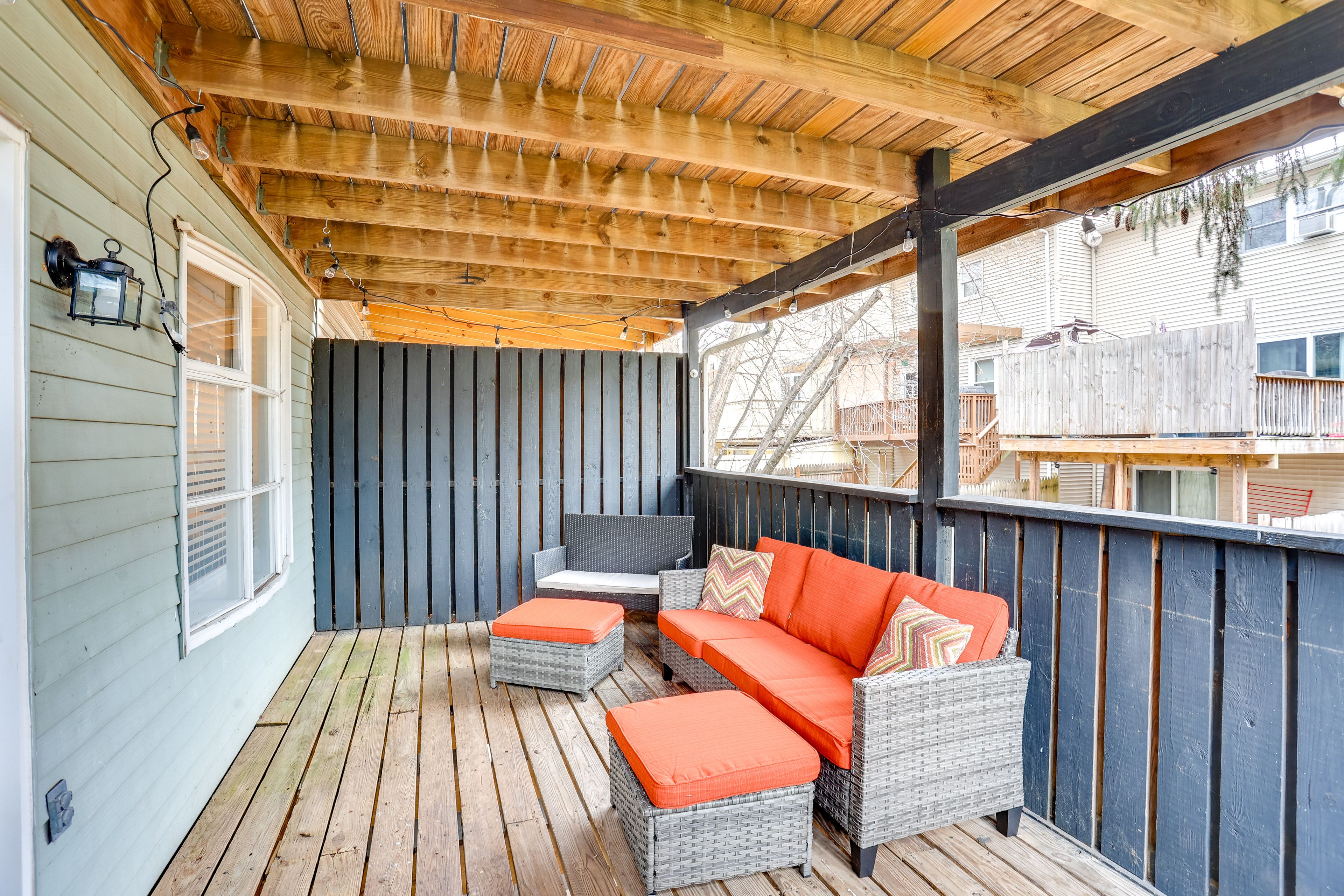 Townhome Exterior | Lower Deck w/ Seating