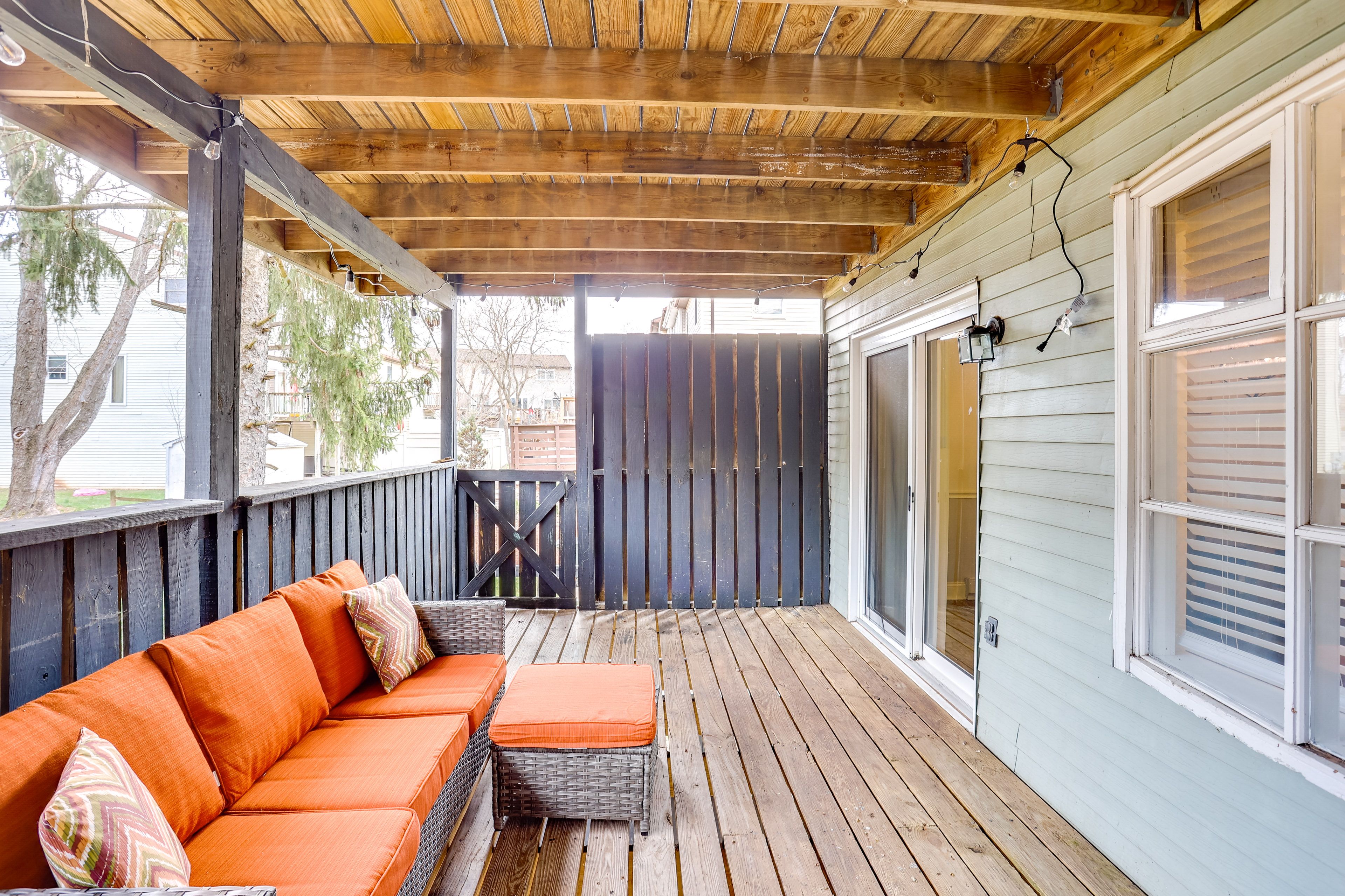 Townhome Exterior | Lower Deck w/ Seating
