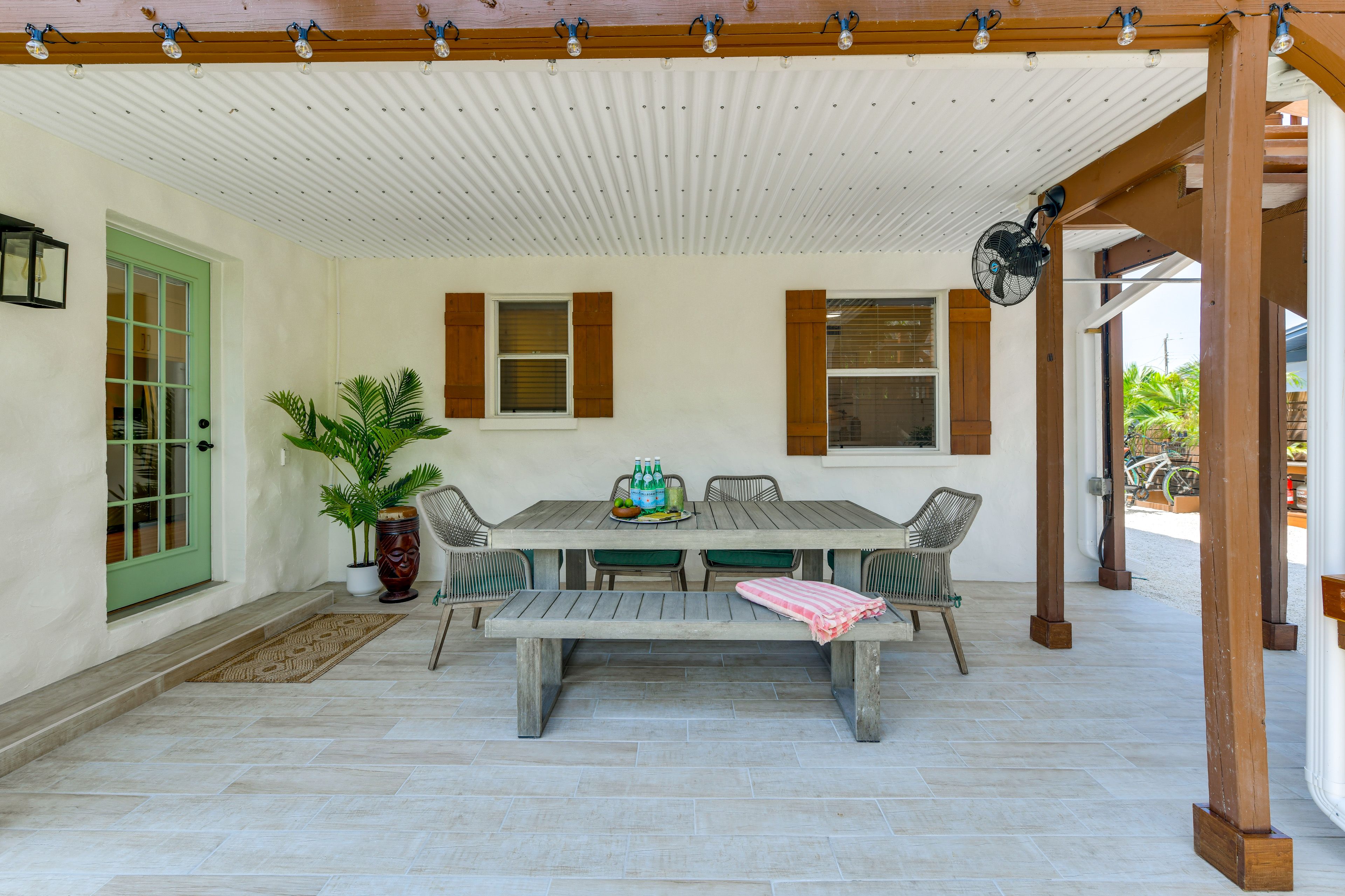 House Exterior | Covered Patio w/ Dining Area