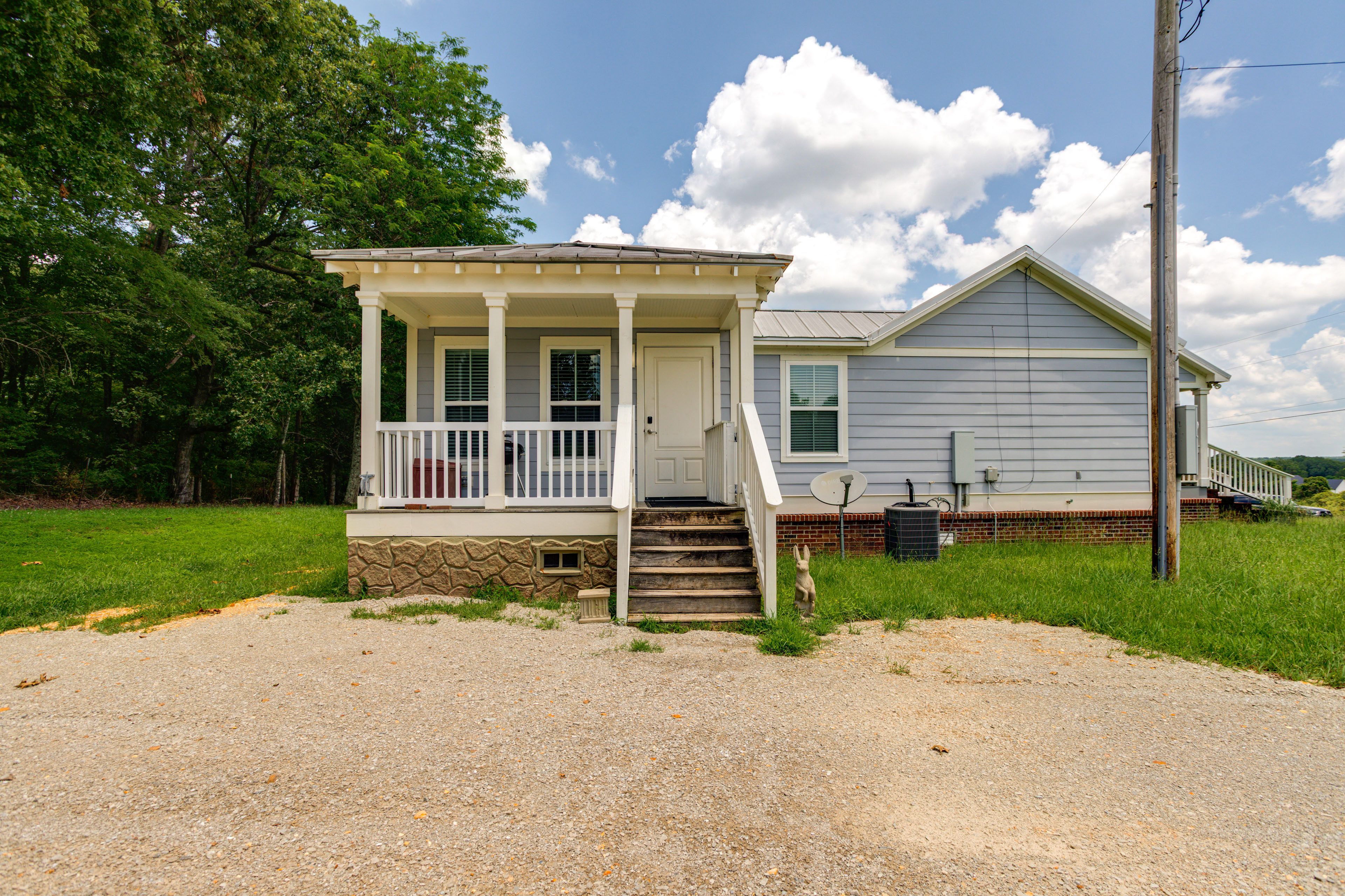Back Exterior | Main Entrance | Deck w/ Charcoal Grill