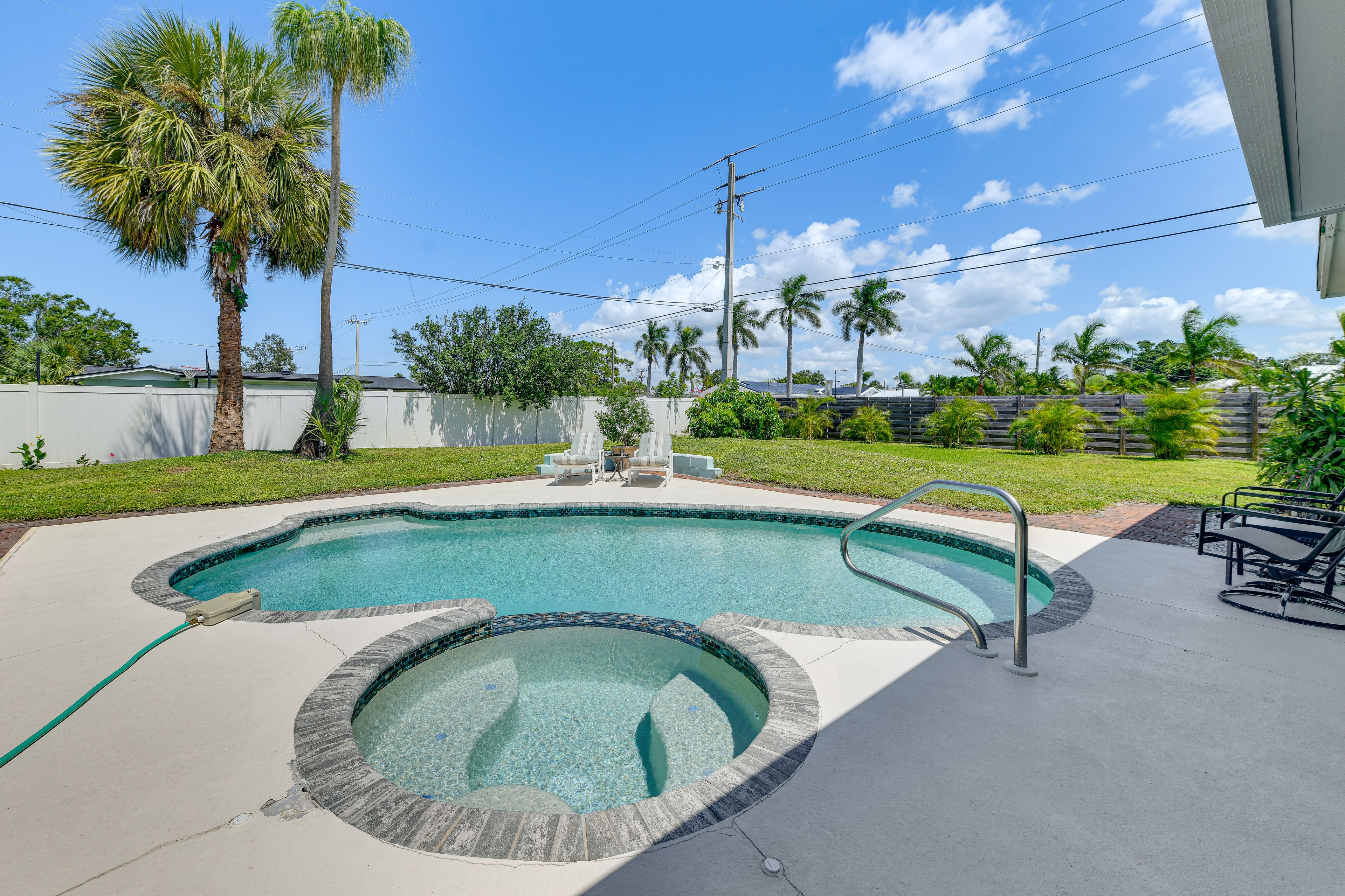 Fenced-In Yard | Private Heated Pool | Lounging Furniture