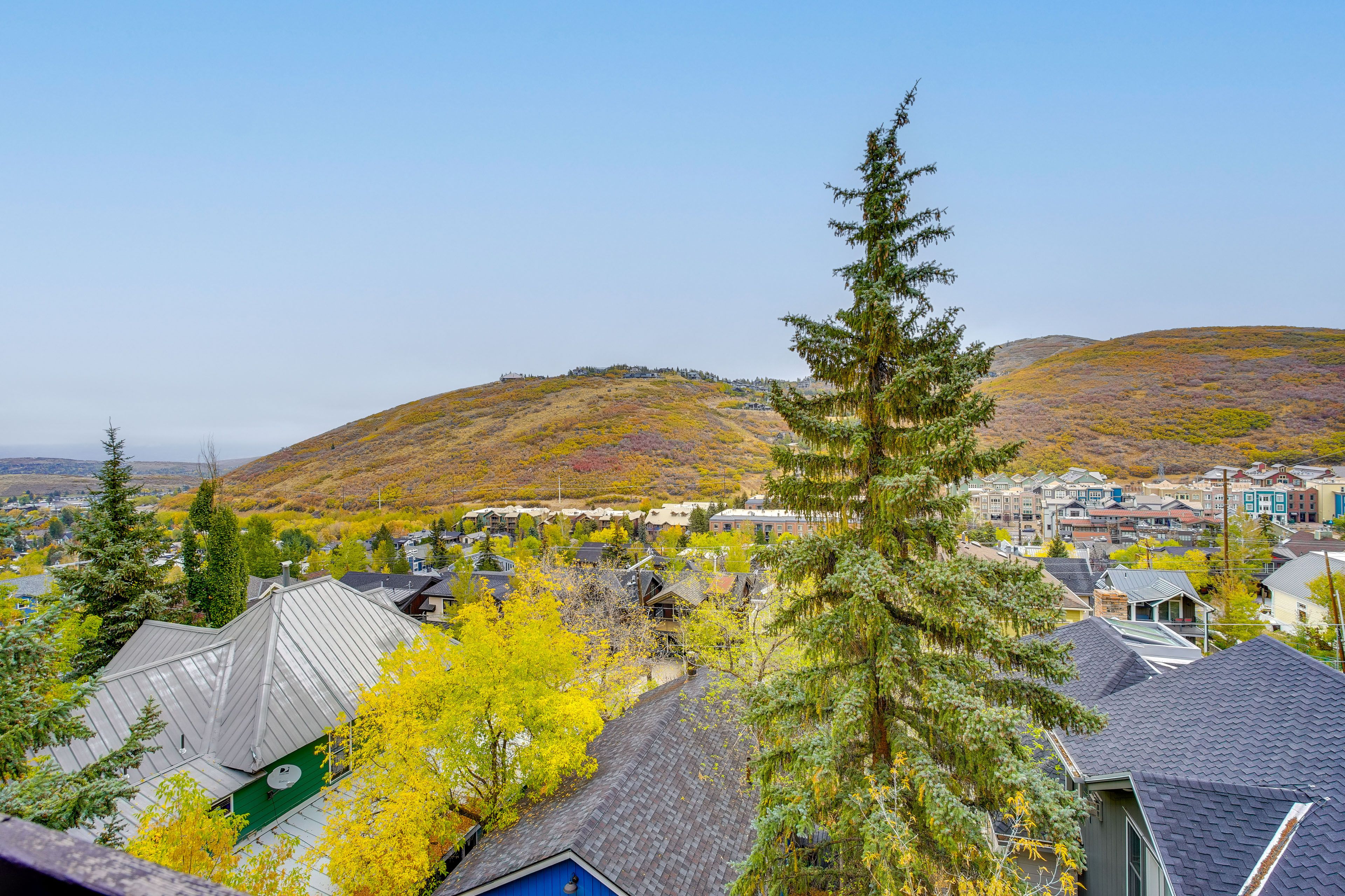 Condo Exterior | Mountain Views | Designated Garage Spot (1 Vehicle)