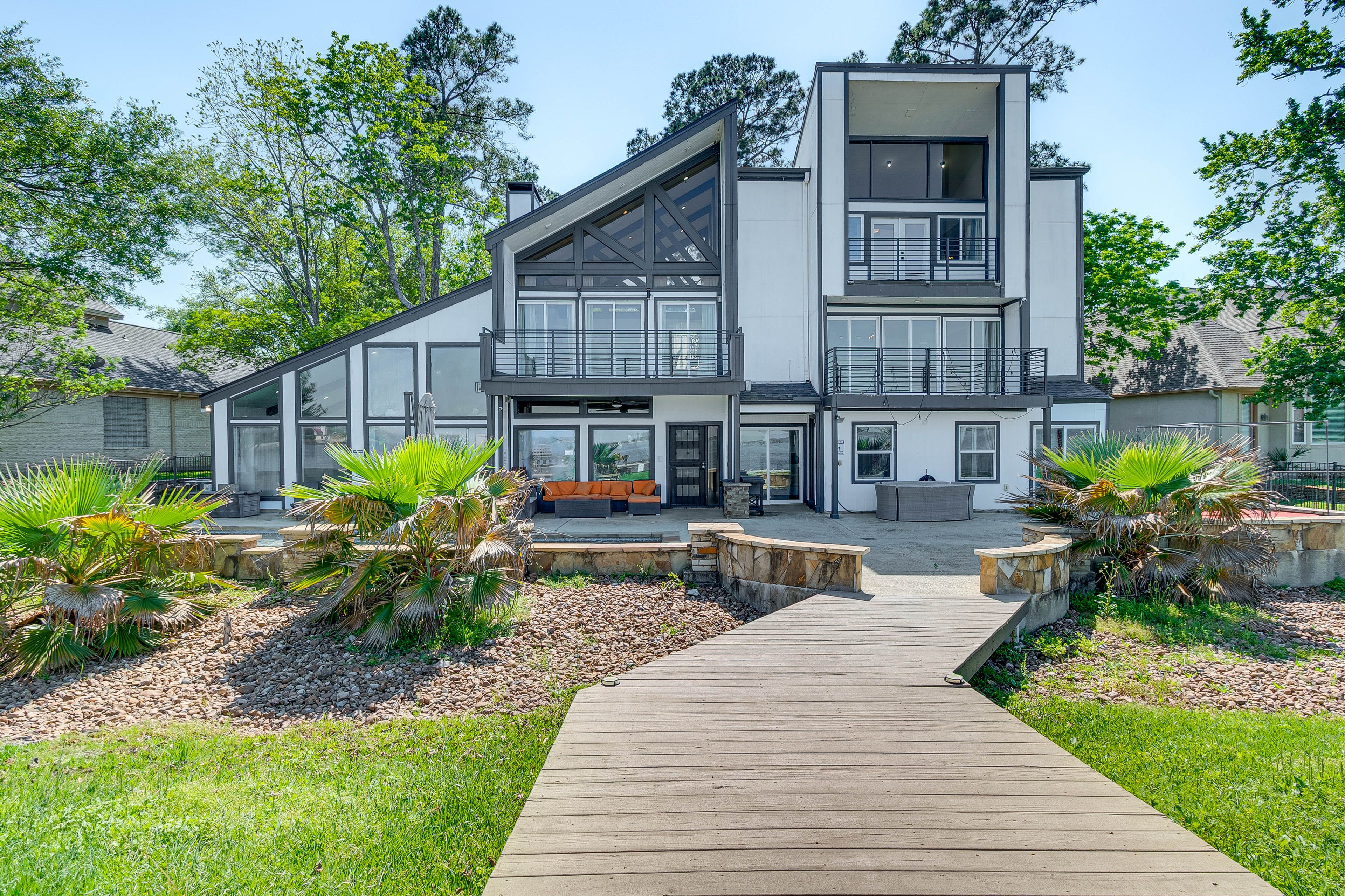 Property Exterior | 3-Story Home | Private Pool | Dock w/ Boat Slip