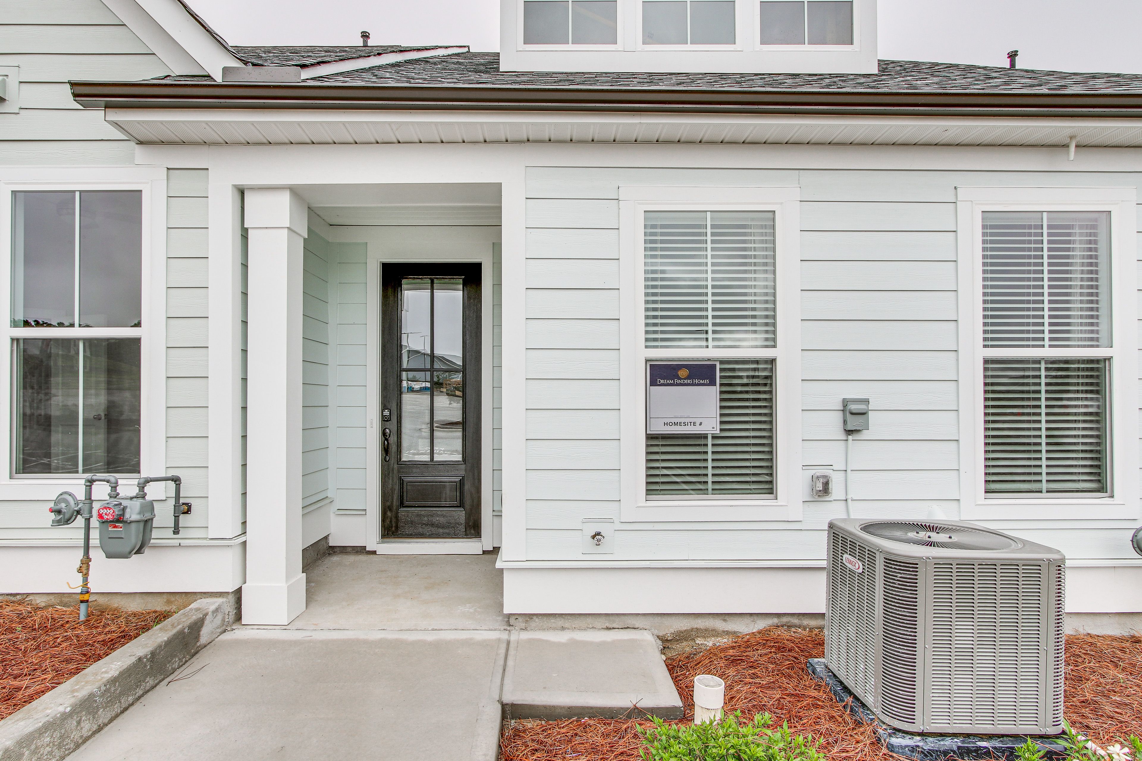 Townhome Exterior | Parking | Designated Parking (2 Vehicles)