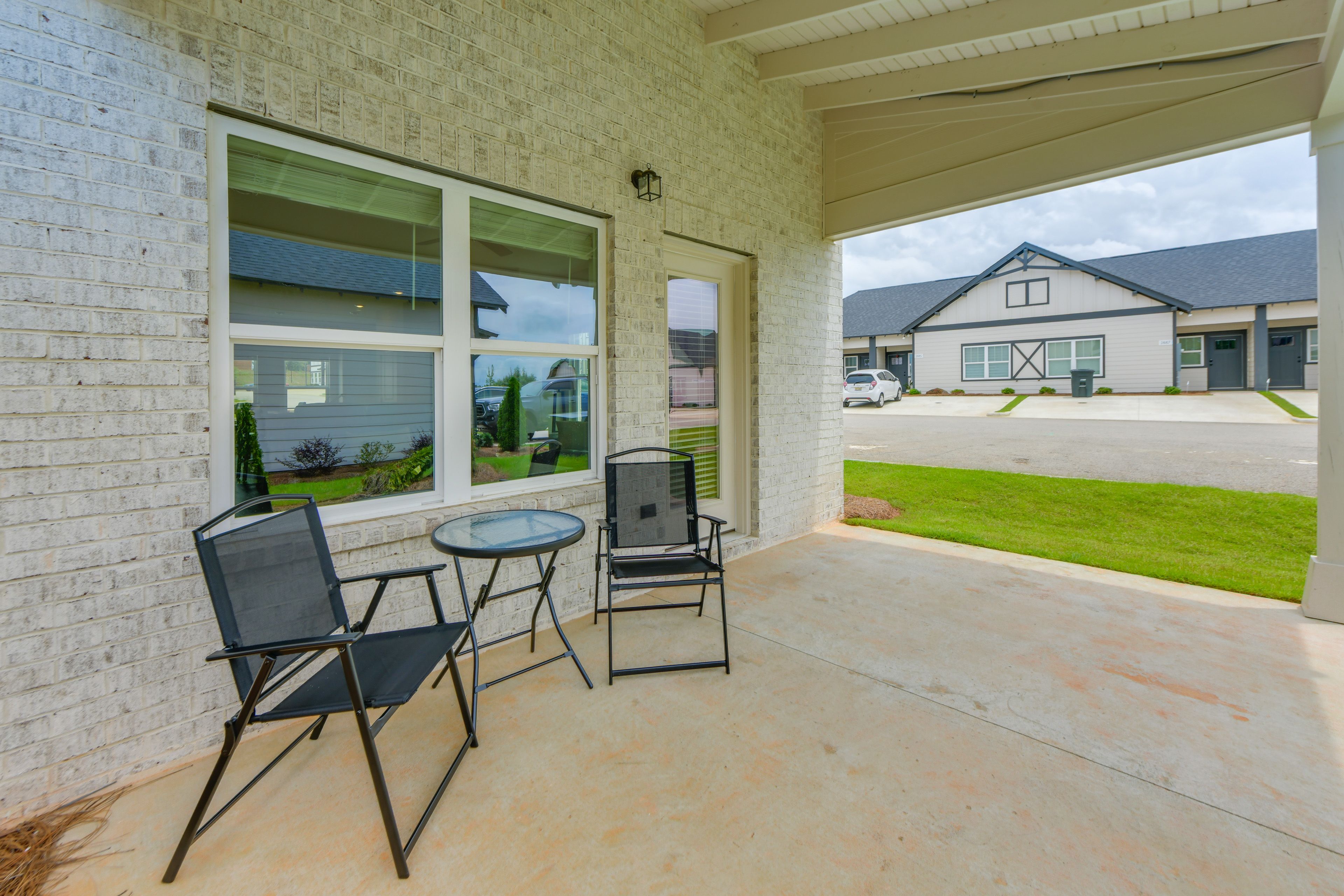 Townhome Exterior | Covered Patio w/ Seating