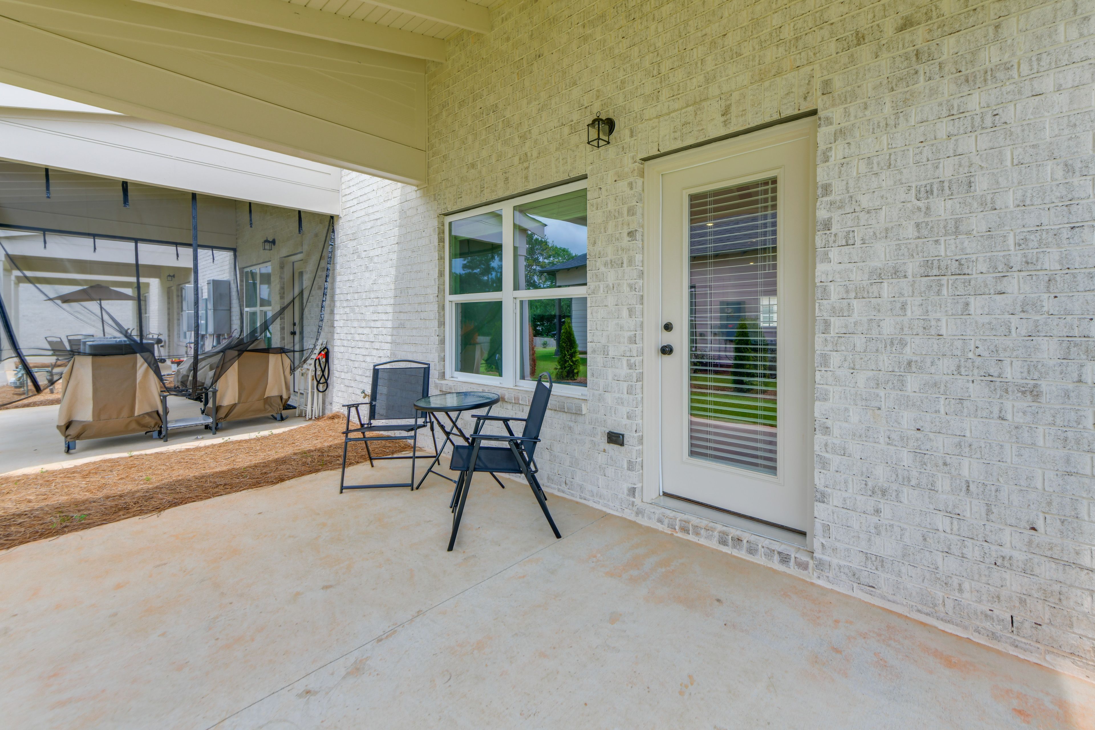 Townhome Exterior | Covered Patio w/ Seating