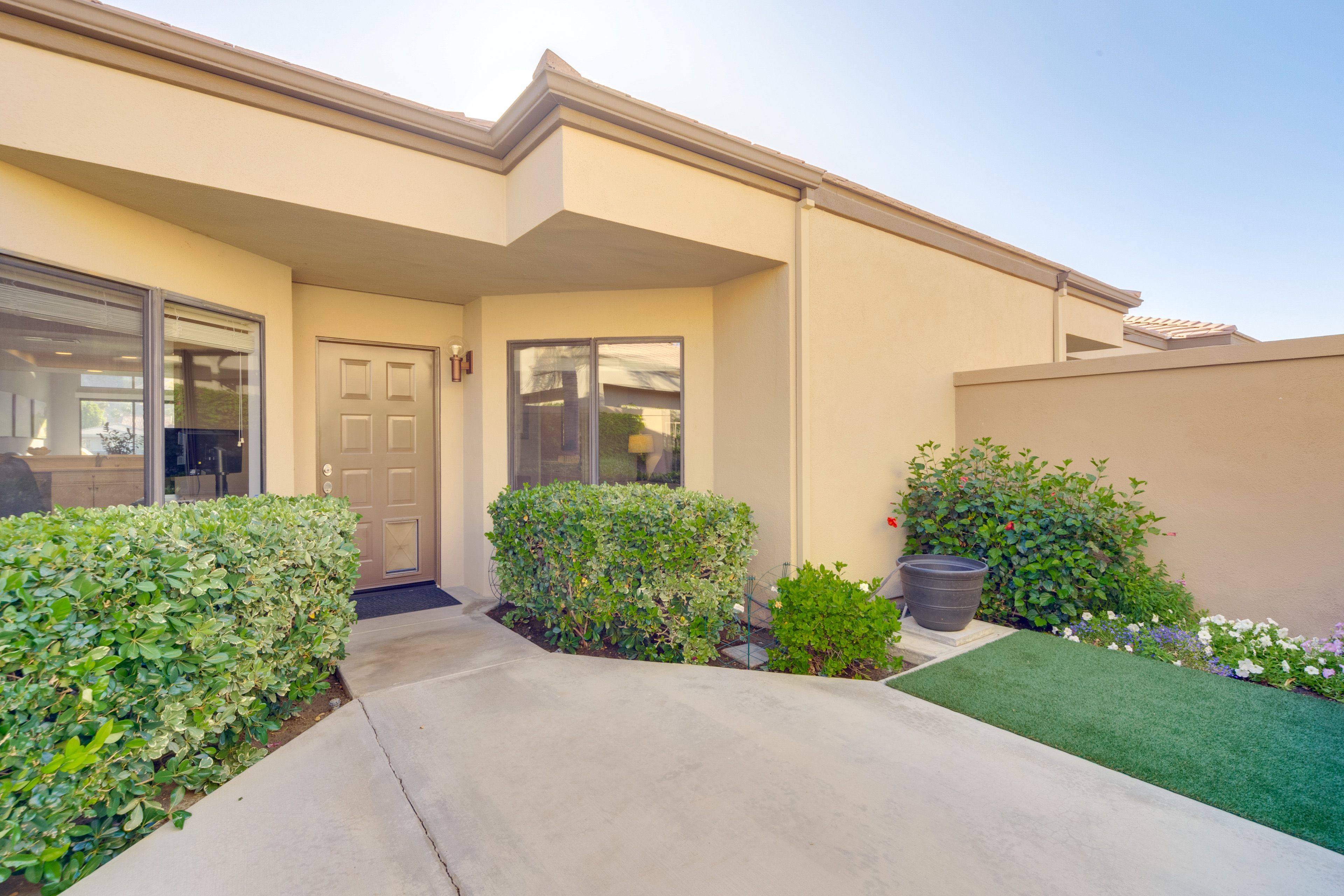 Unit Entrance | Fenced-In Patio w/ Dog Door