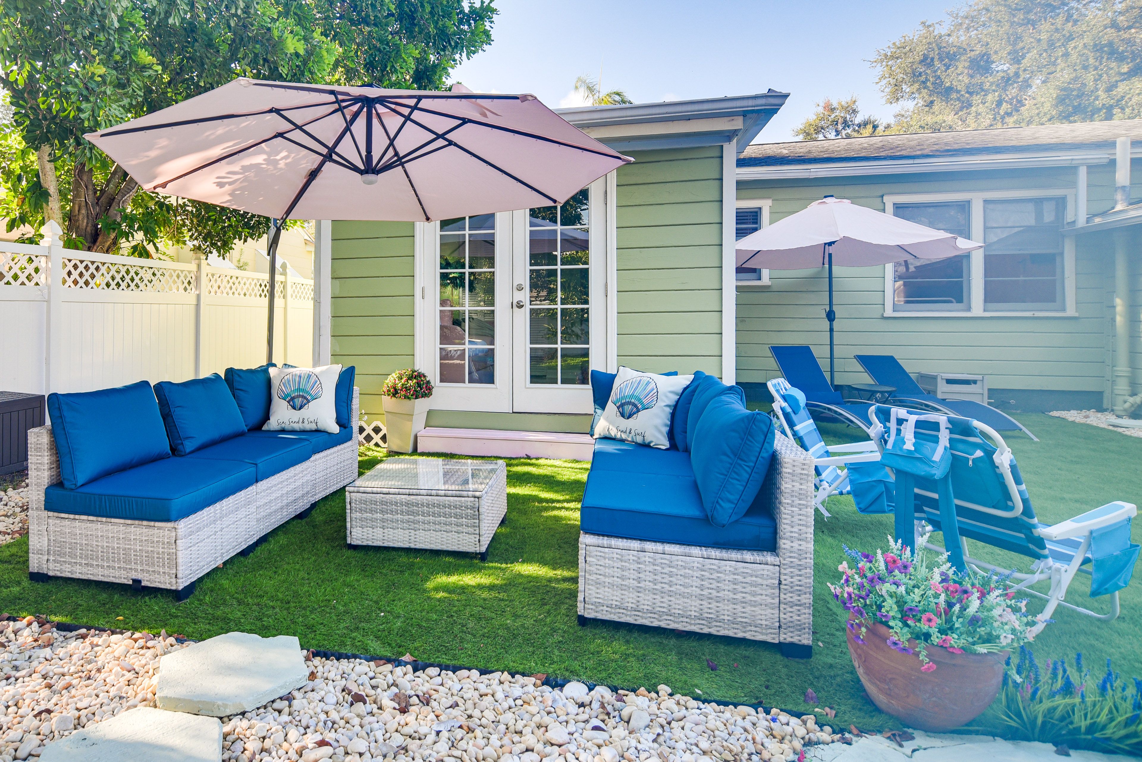 House Exterior | Seating Area w/ Umbrellas