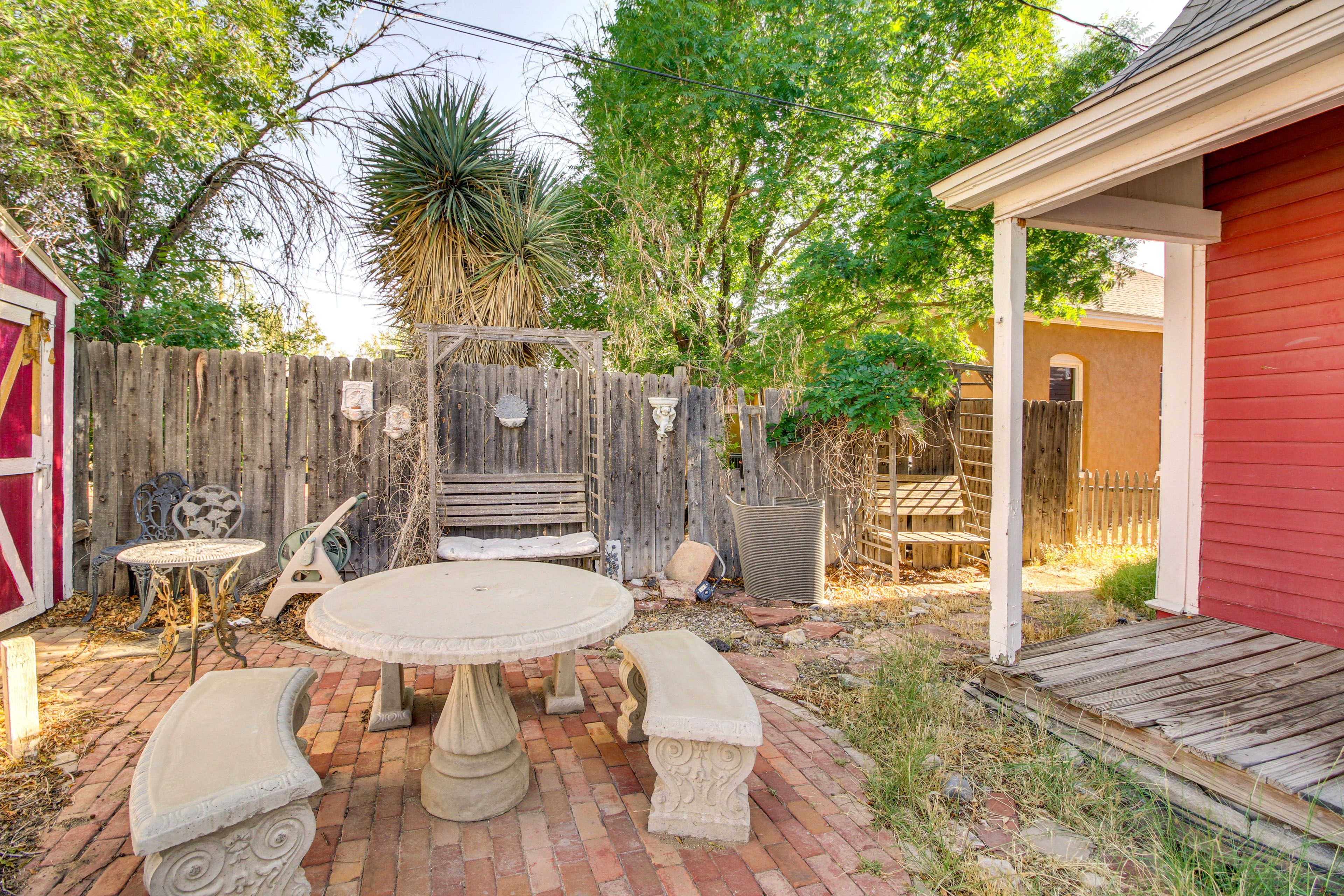 Fenced-In Yard | Outdoor Dining Areas | Covered Porch w/ Seating