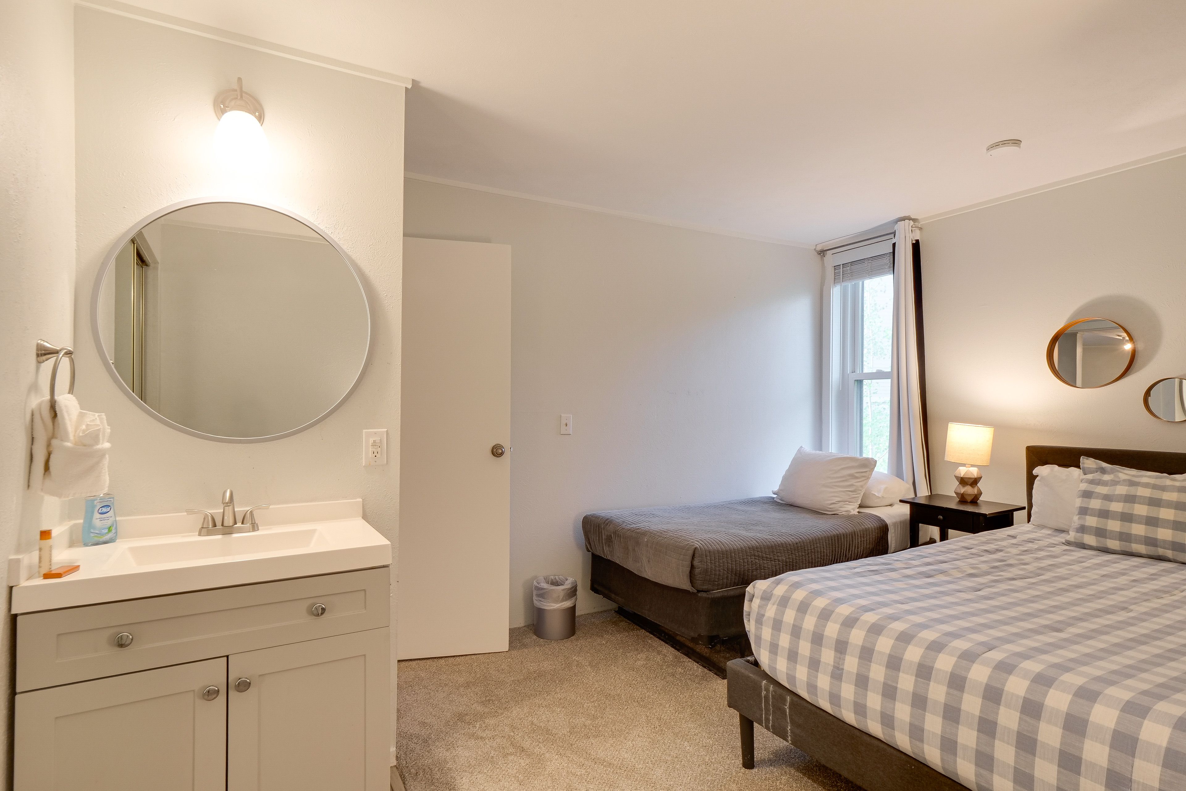Bedroom 1 | Queen Bed | Twin Bed | En-Suite Sink/Vanity | Linens Provided