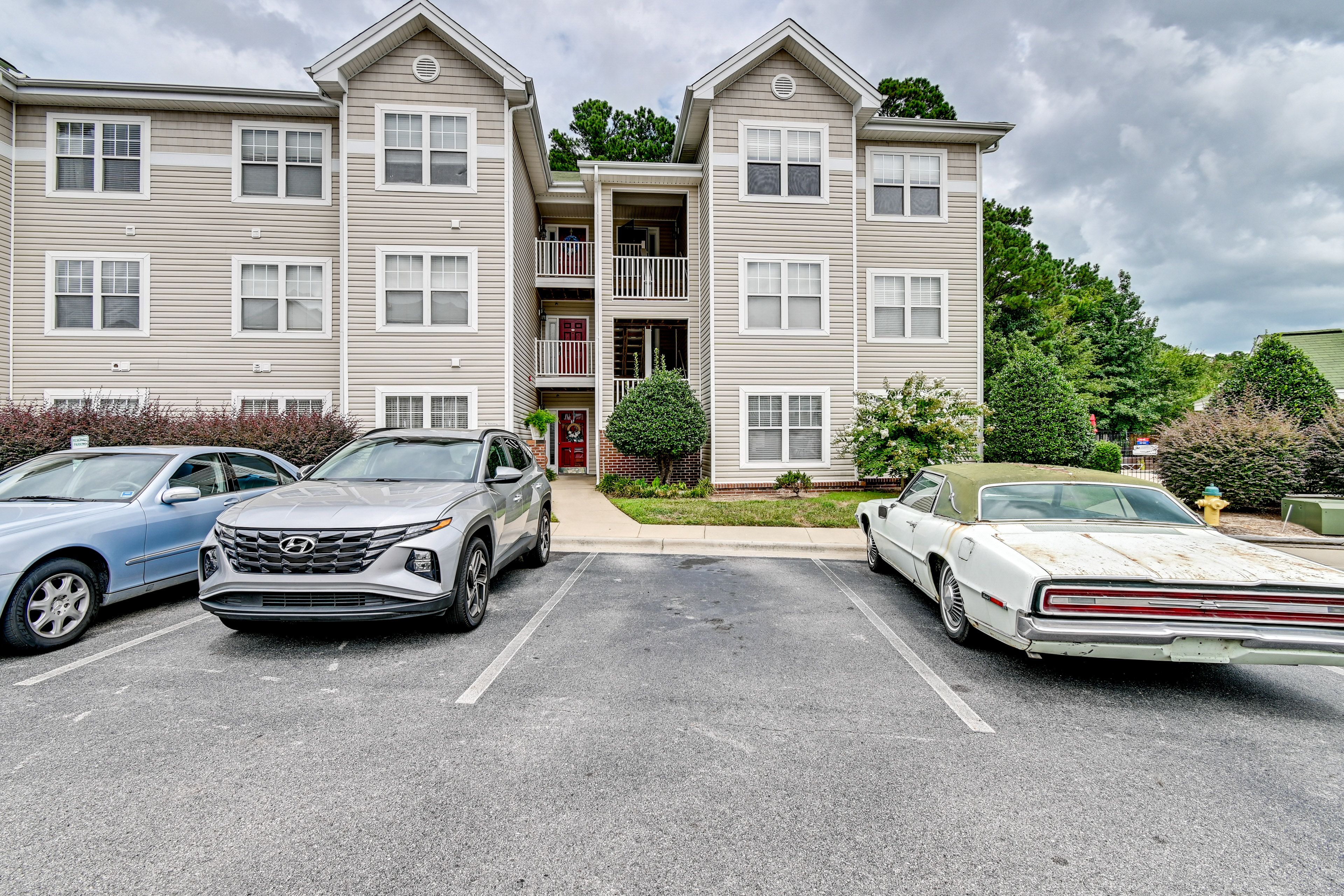 Building Exterior | Open Community Parking Lots (4 Vehicles)