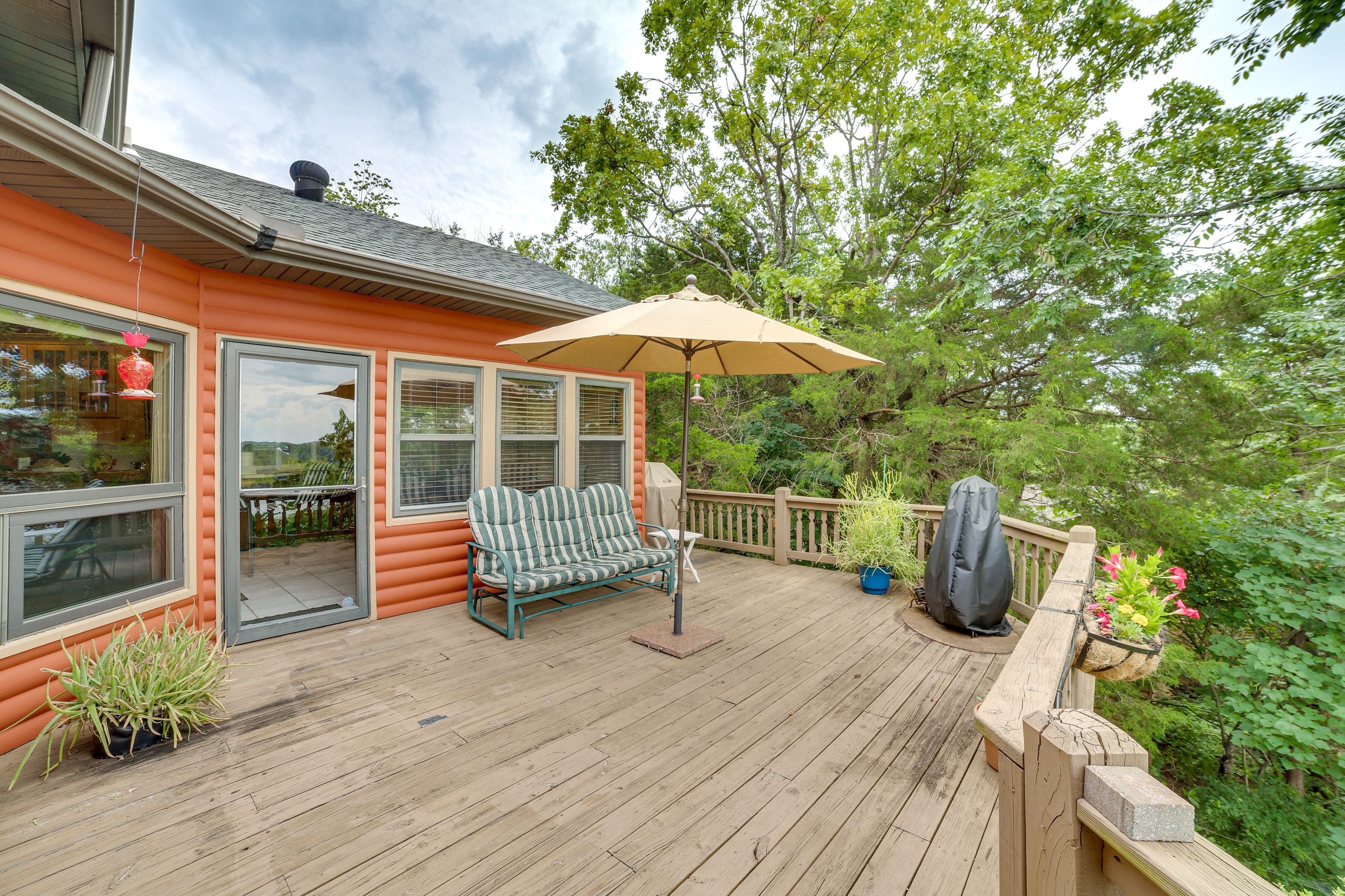 Cabin Exterior | Wraparound Deck w/ Seating | Gas Grill | Lake Views