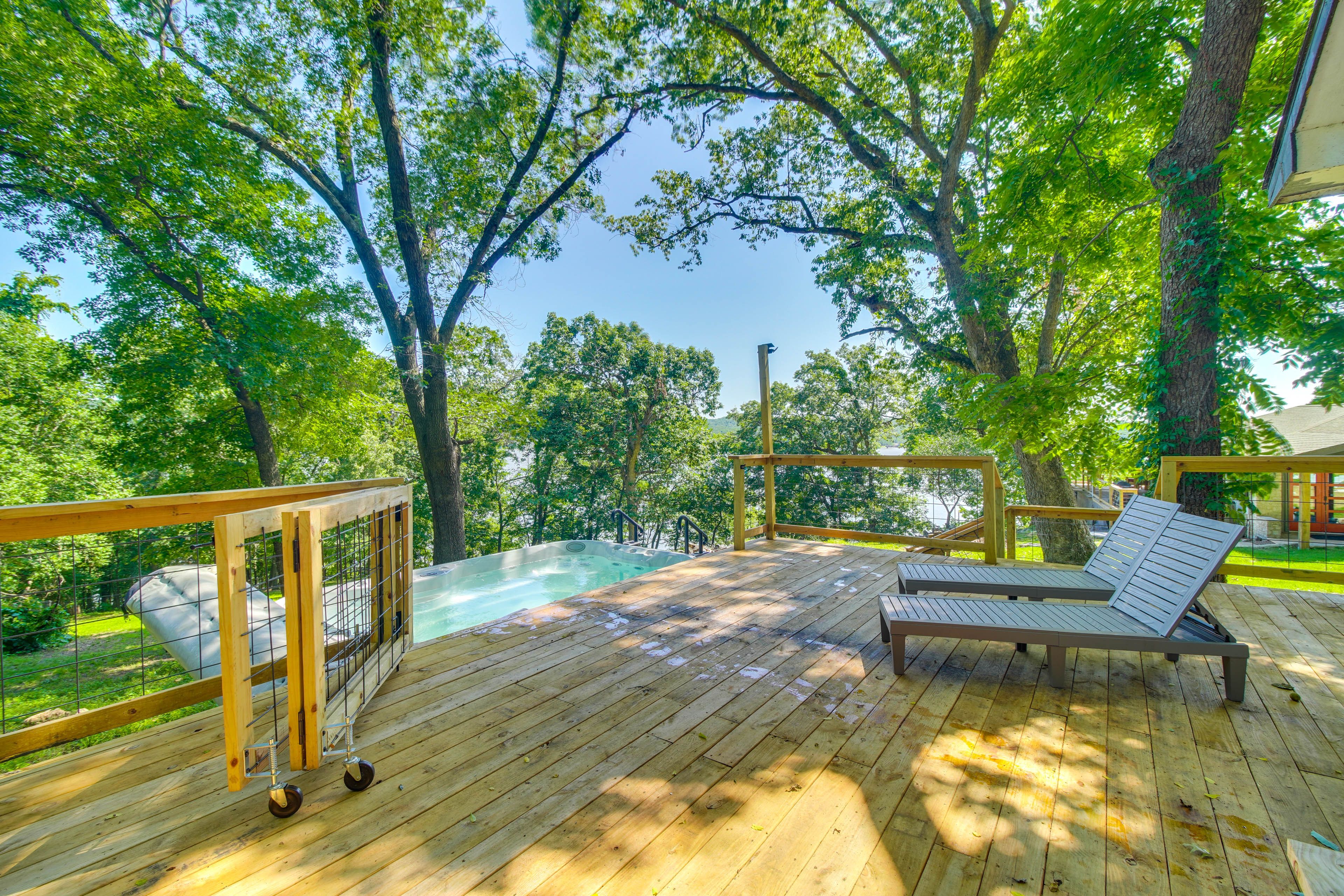 9-Person Hot Tub/Swim Spa | Deck w/ Lounge Chairs | Lakefront View