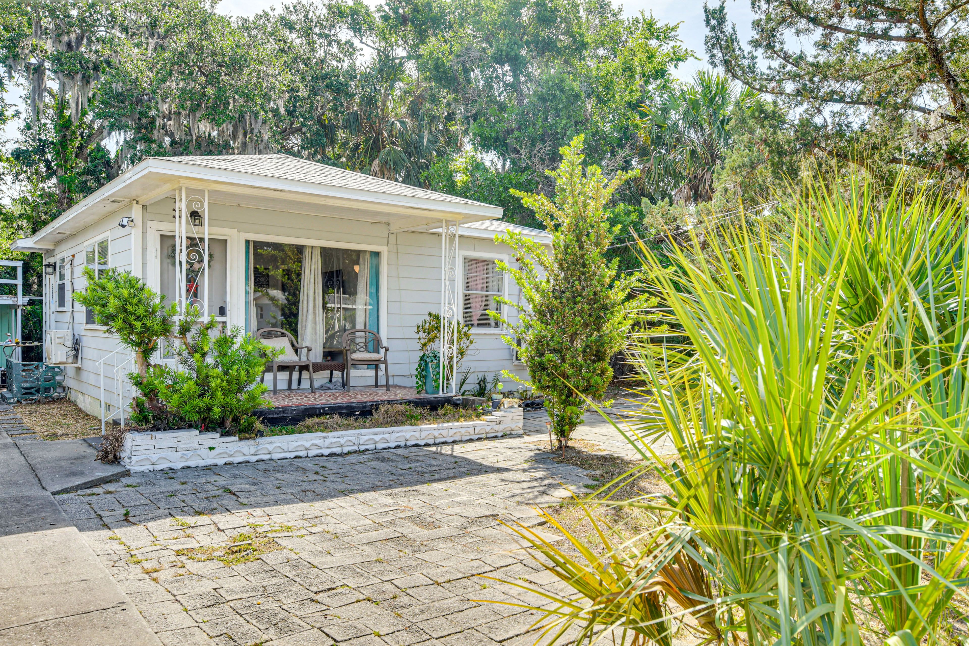 Cottage Exterior | Charcoal Grill | Partially Fenced Backyard