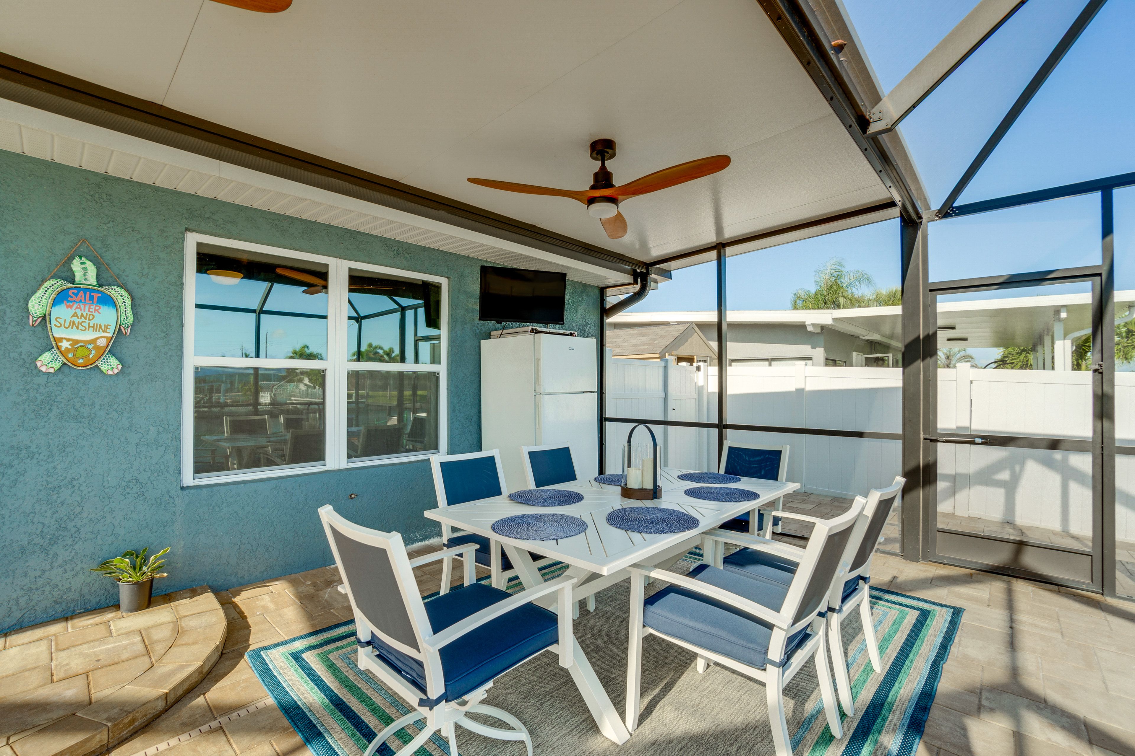 House Exterior | Furnished Lanai | Dining Area | TV | Electric Grill