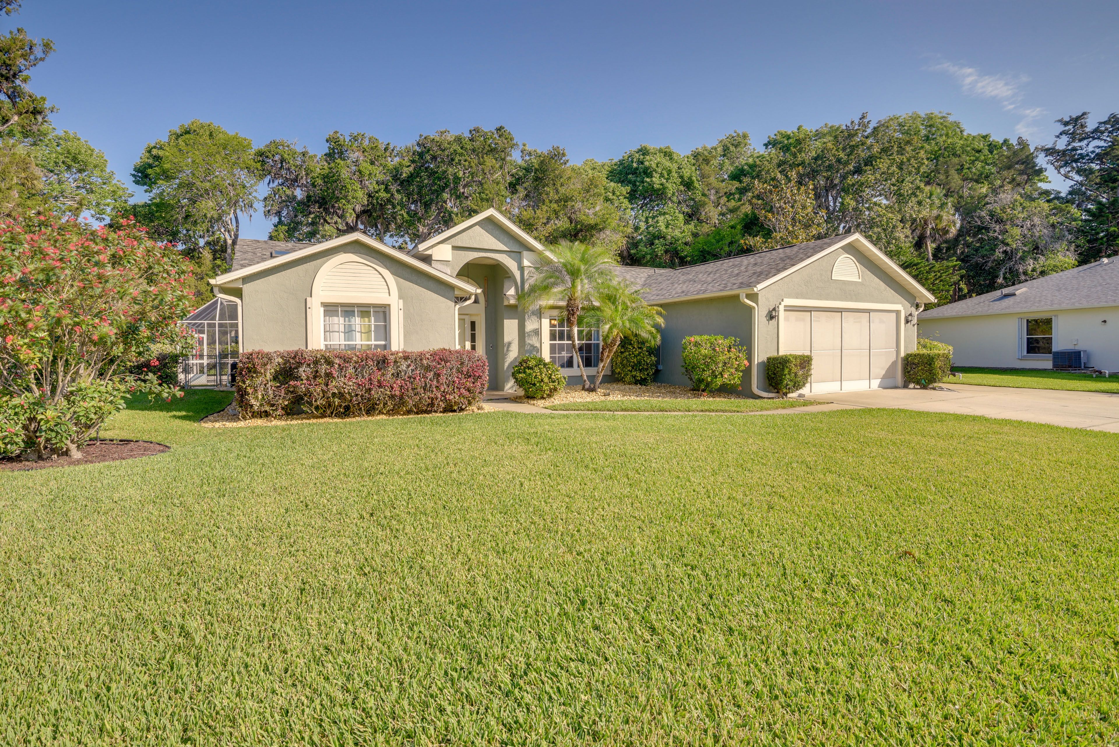 Property Exterior | Screened-In Lanai | Private Pool | Spacious Yard