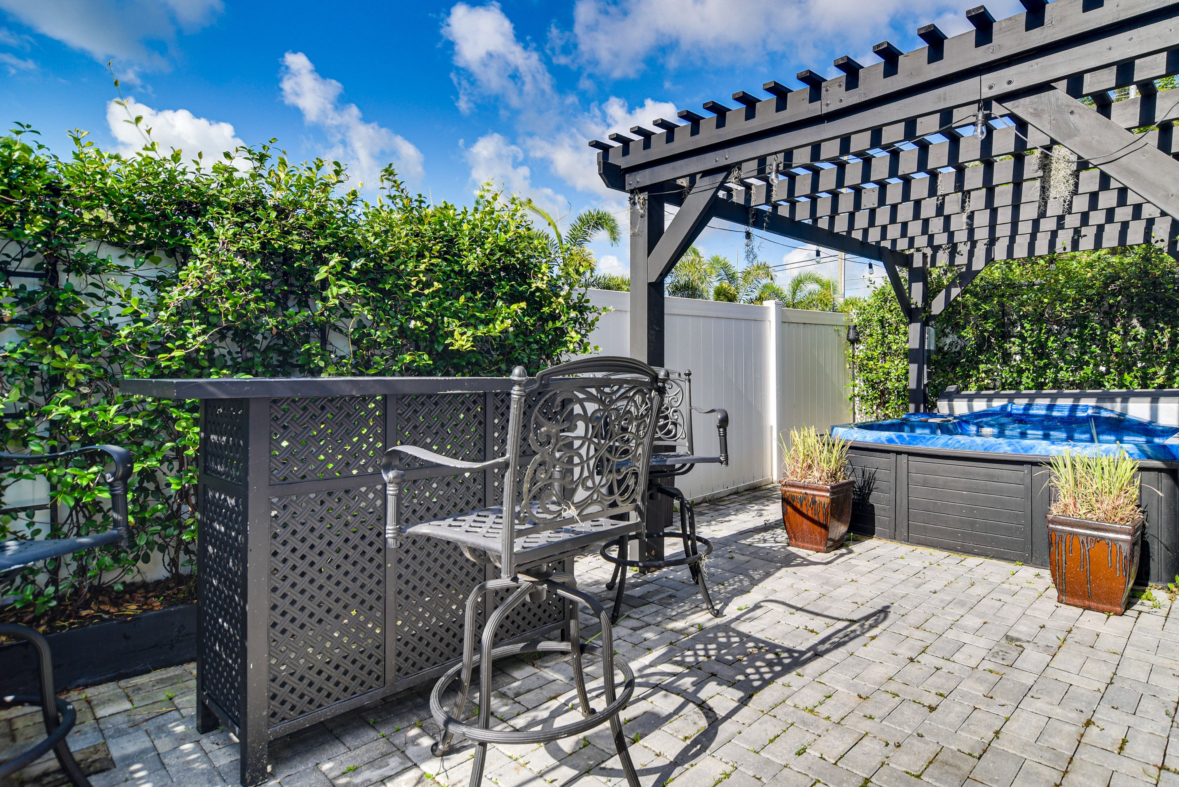 Back Patio | Bar w/ Seating | Dining Area | Private Hot Tub