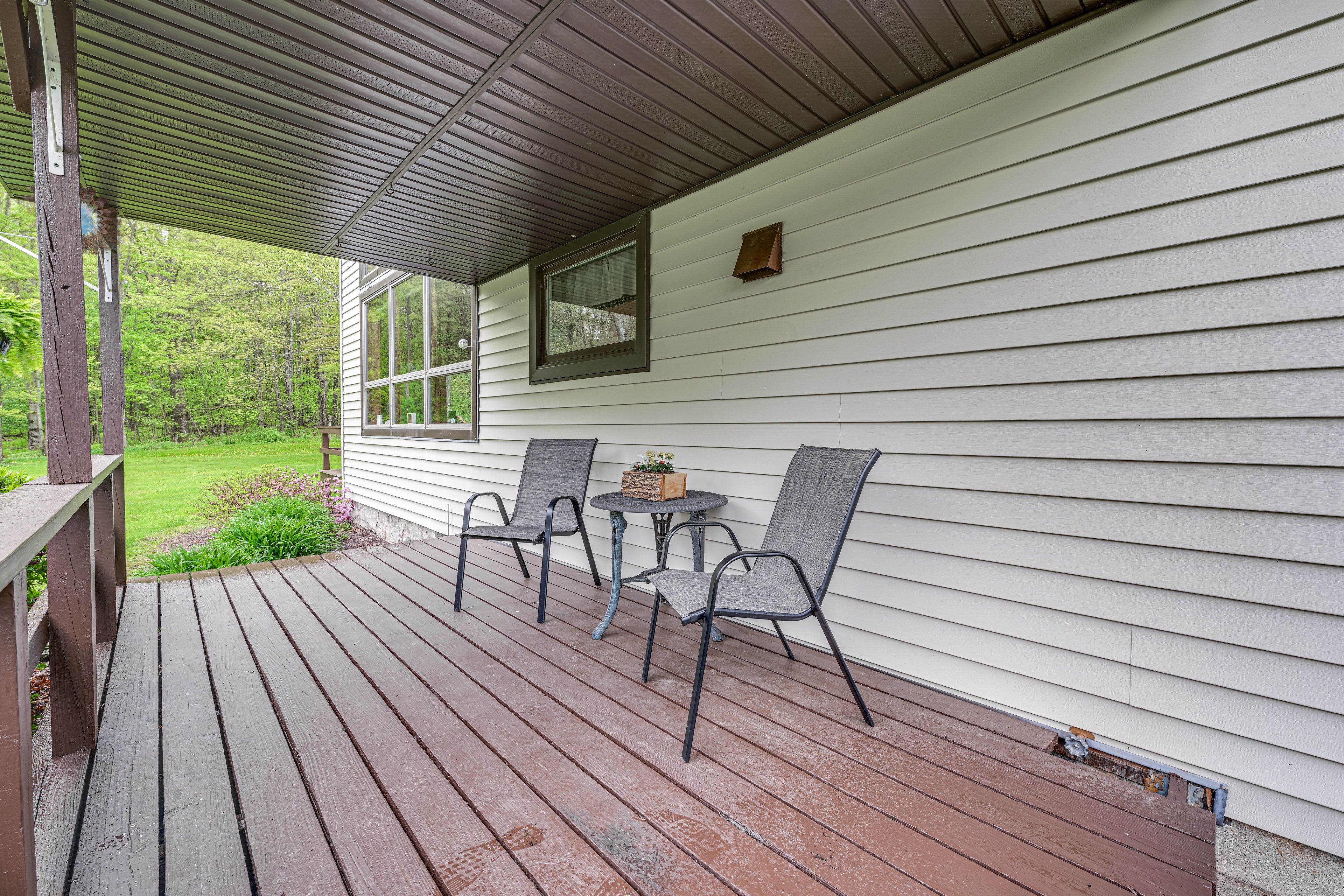 Cottage Exterior | Covered Deck w/ Seating