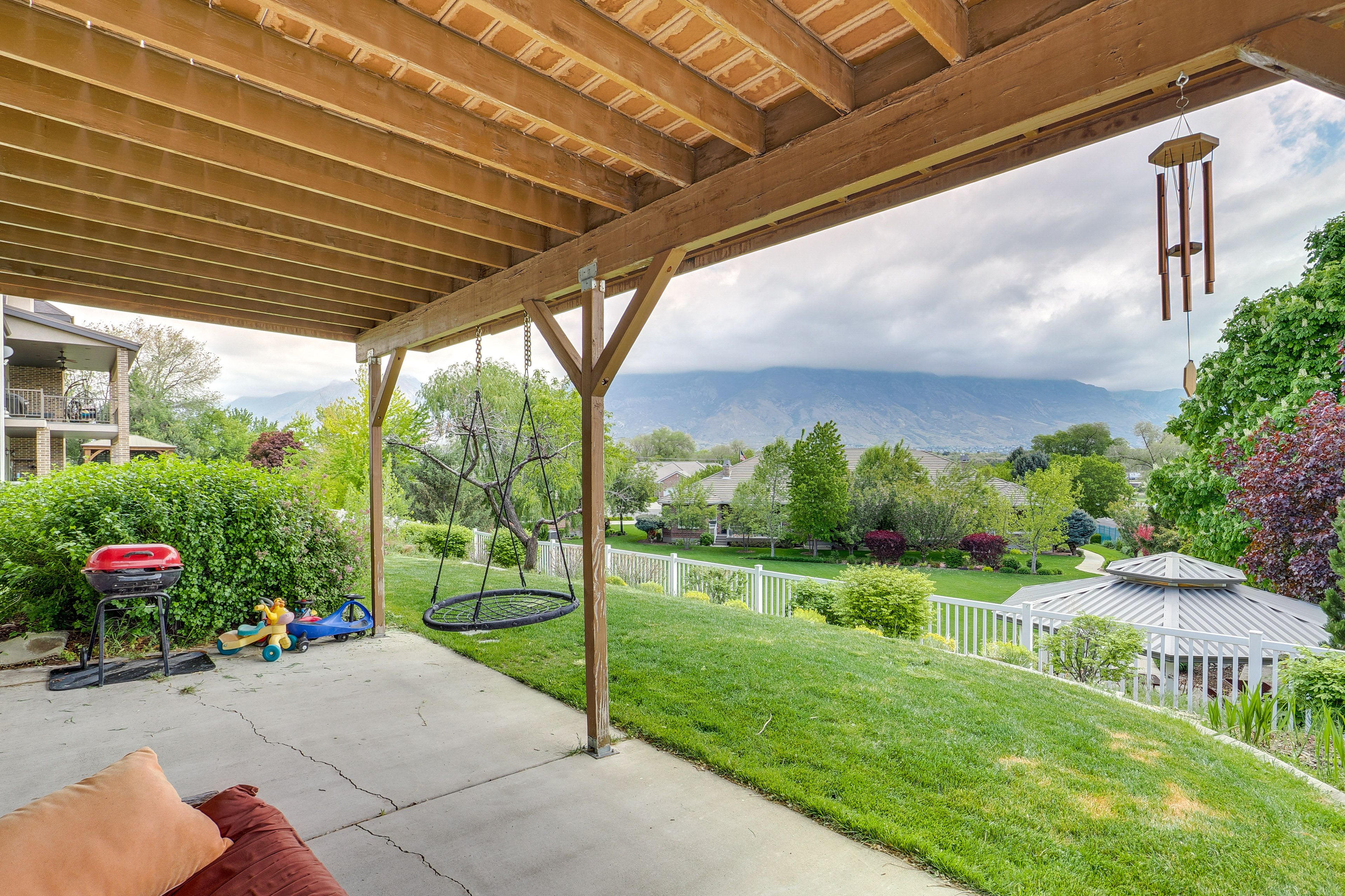 Covered Patio | Mountain Views | Saucer Swing | Charcoal Grill
