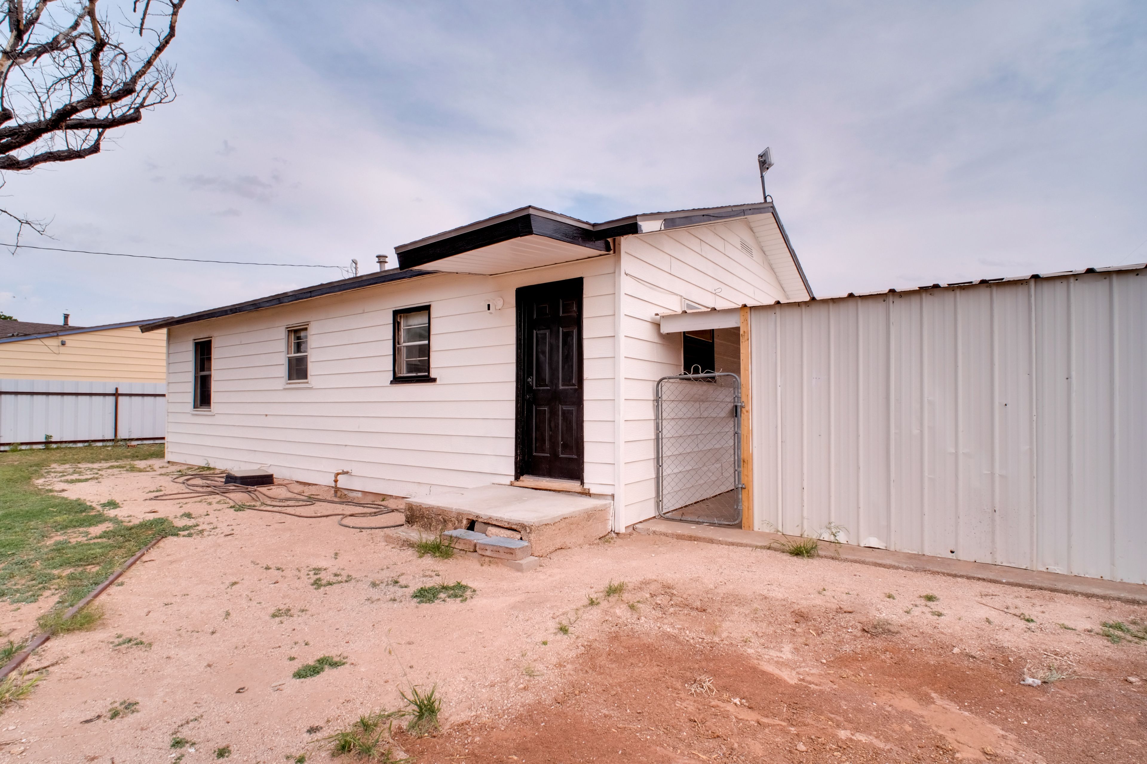 House Exterior | Back Door | Fenced Backyard