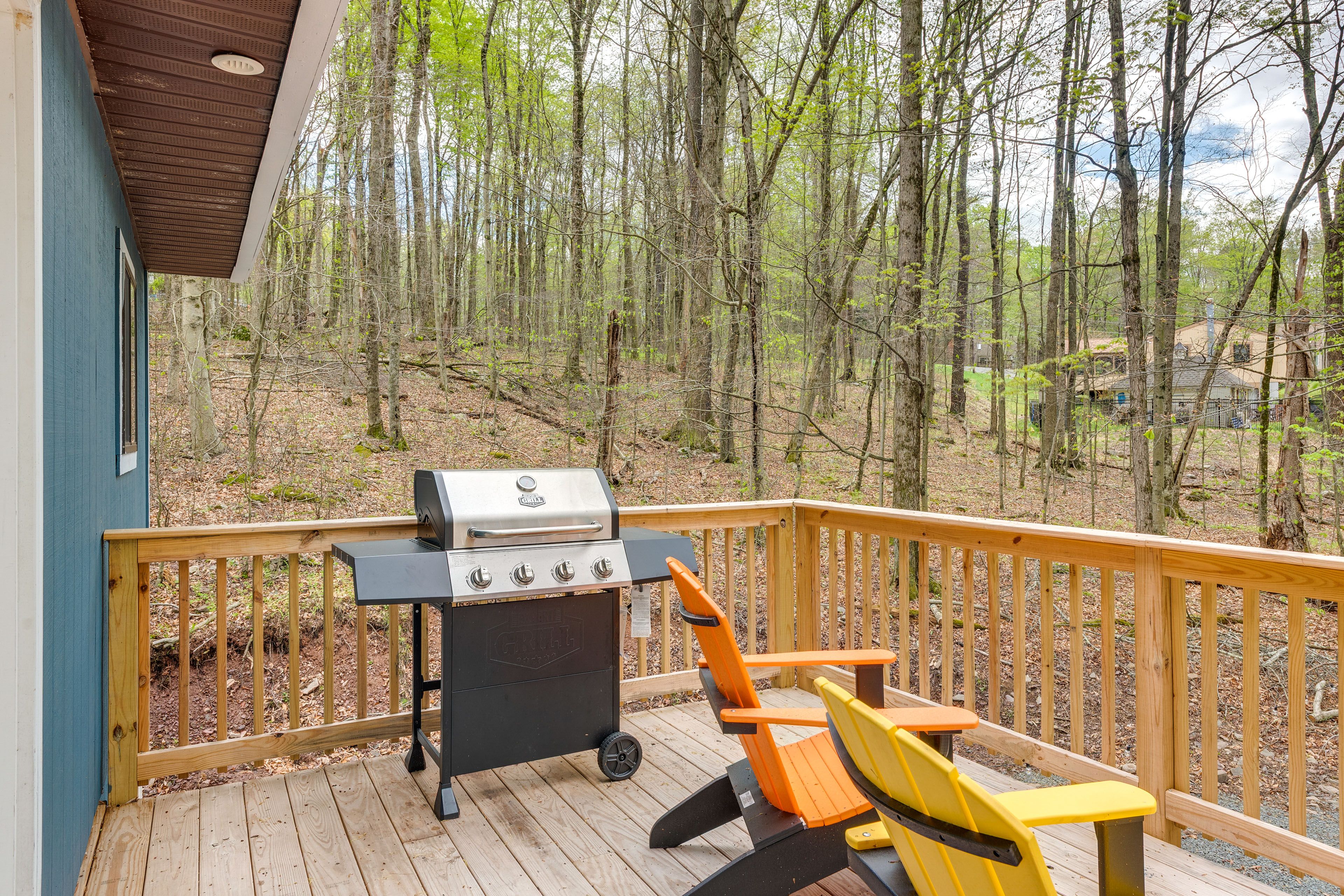 Wraparound Deck | Adirondack Chairs | Gas Grill
