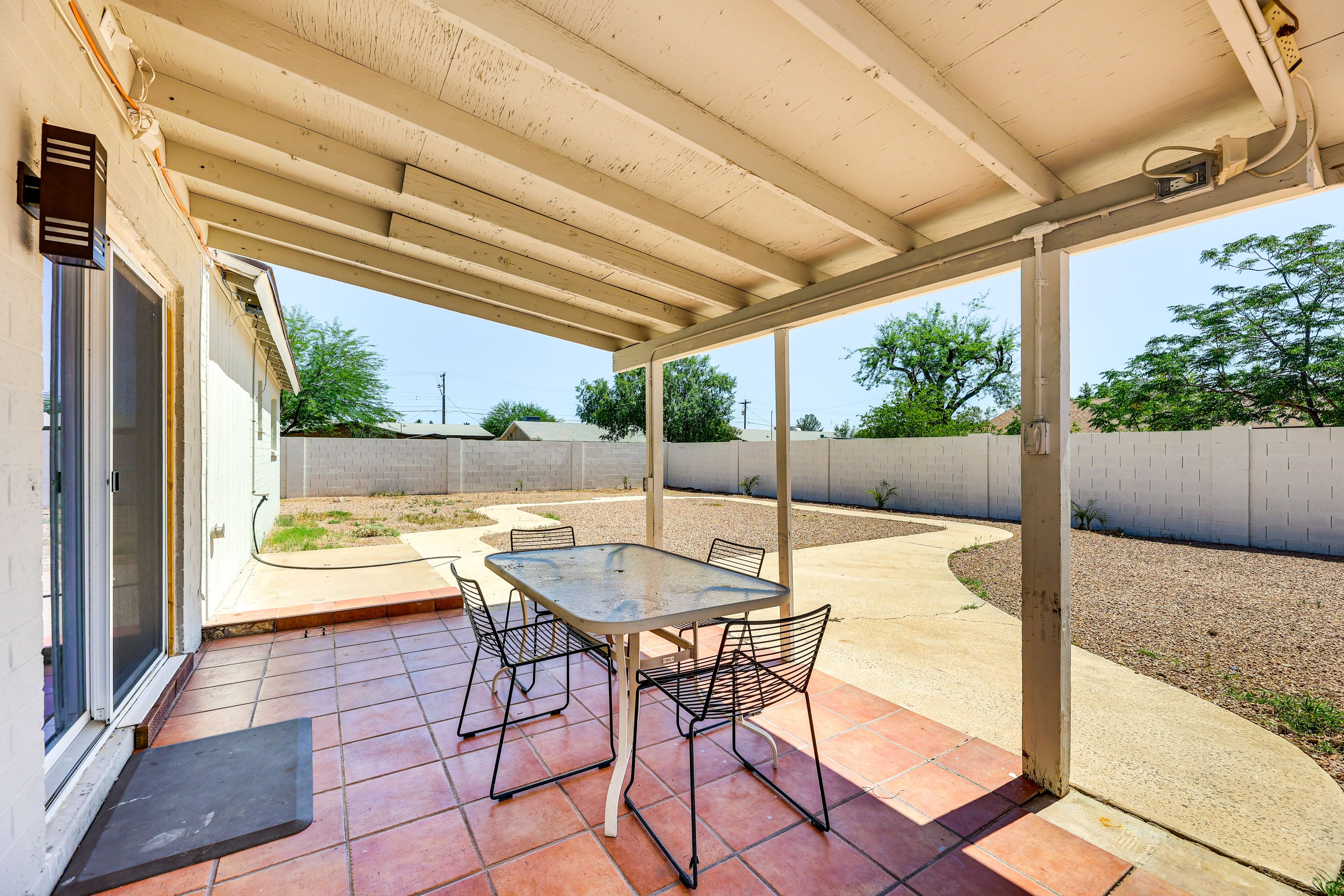 Covered Patio | Charcoal Grill | Outdoor Dining Area | Fenced Backyard