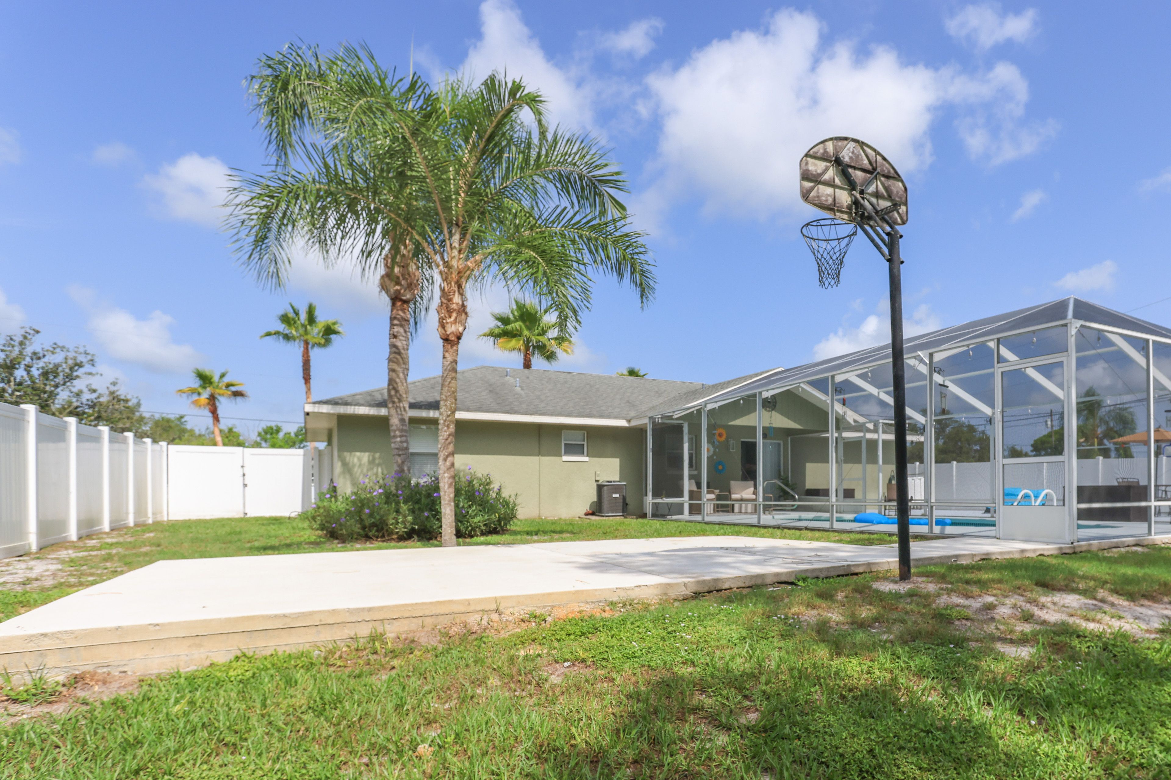 Fenced-In Yard | Screened-In Lanai | Heated Pool | Lounging Furniture