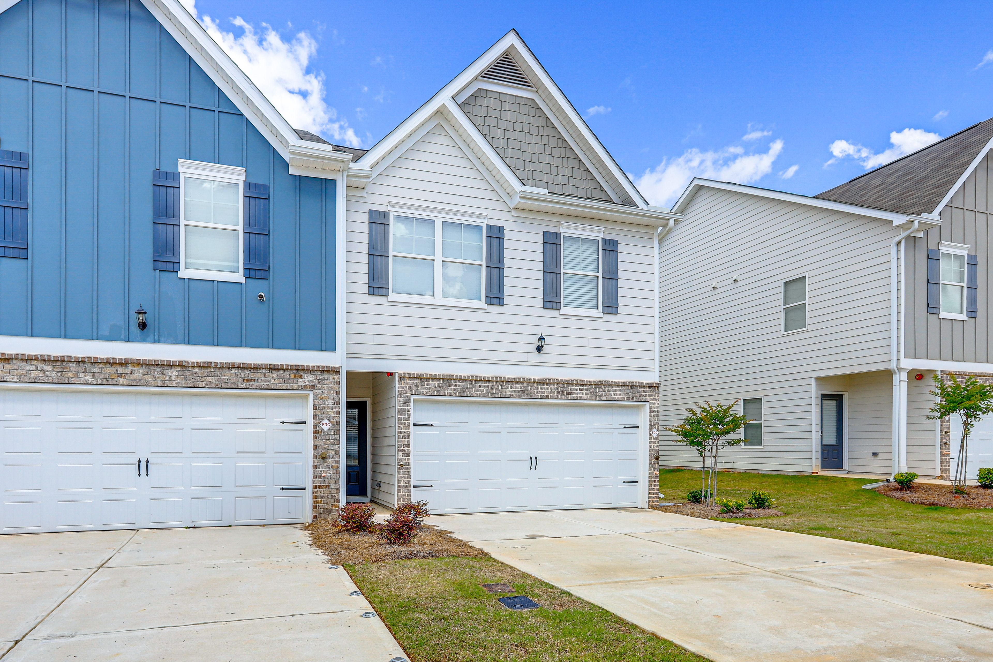 Townhome Exterior | Parking | Garage (2 Vehicles) | Driveway (2 Vehicles)