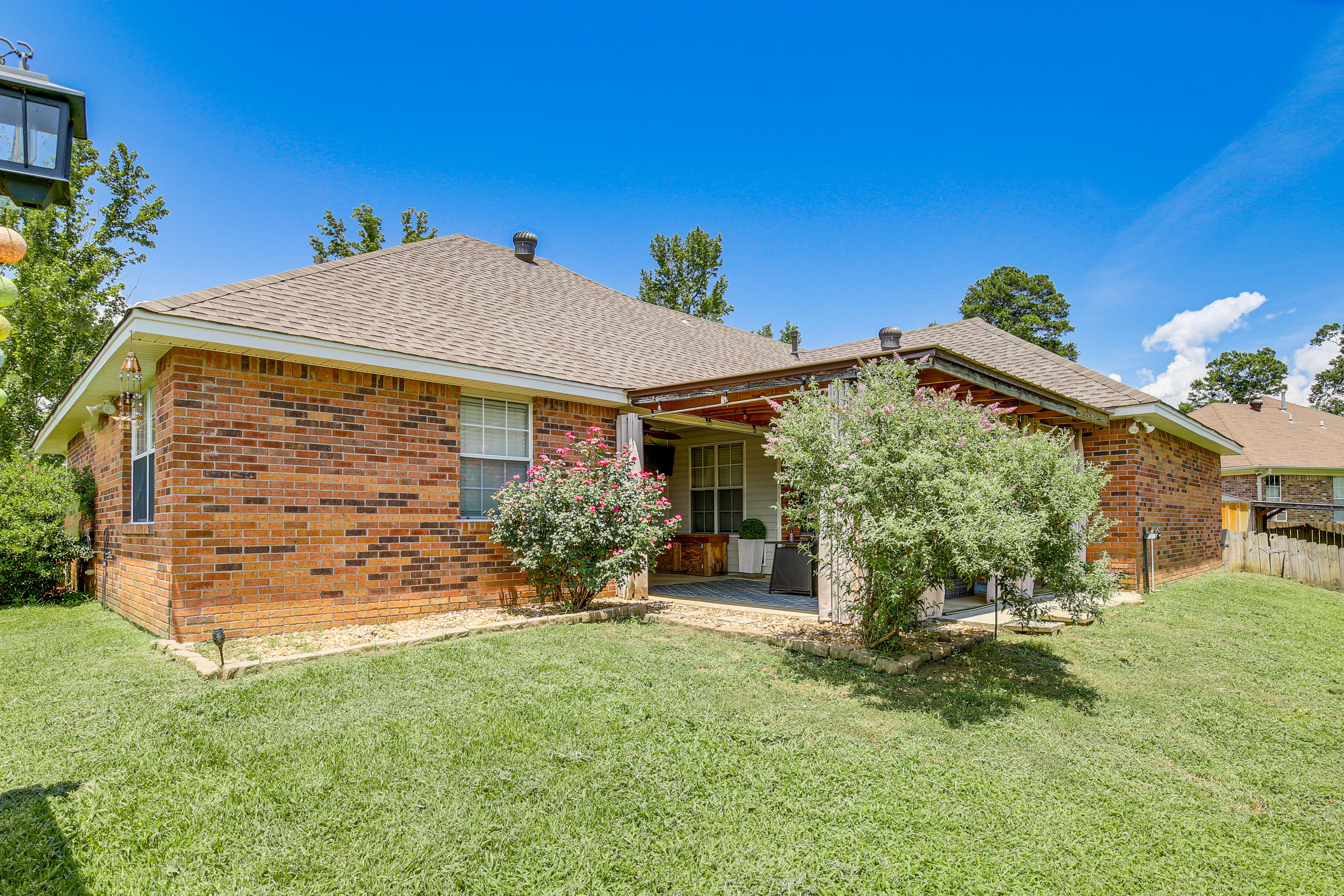 House Exterior | Fenced Backyard | Covered Seating Area