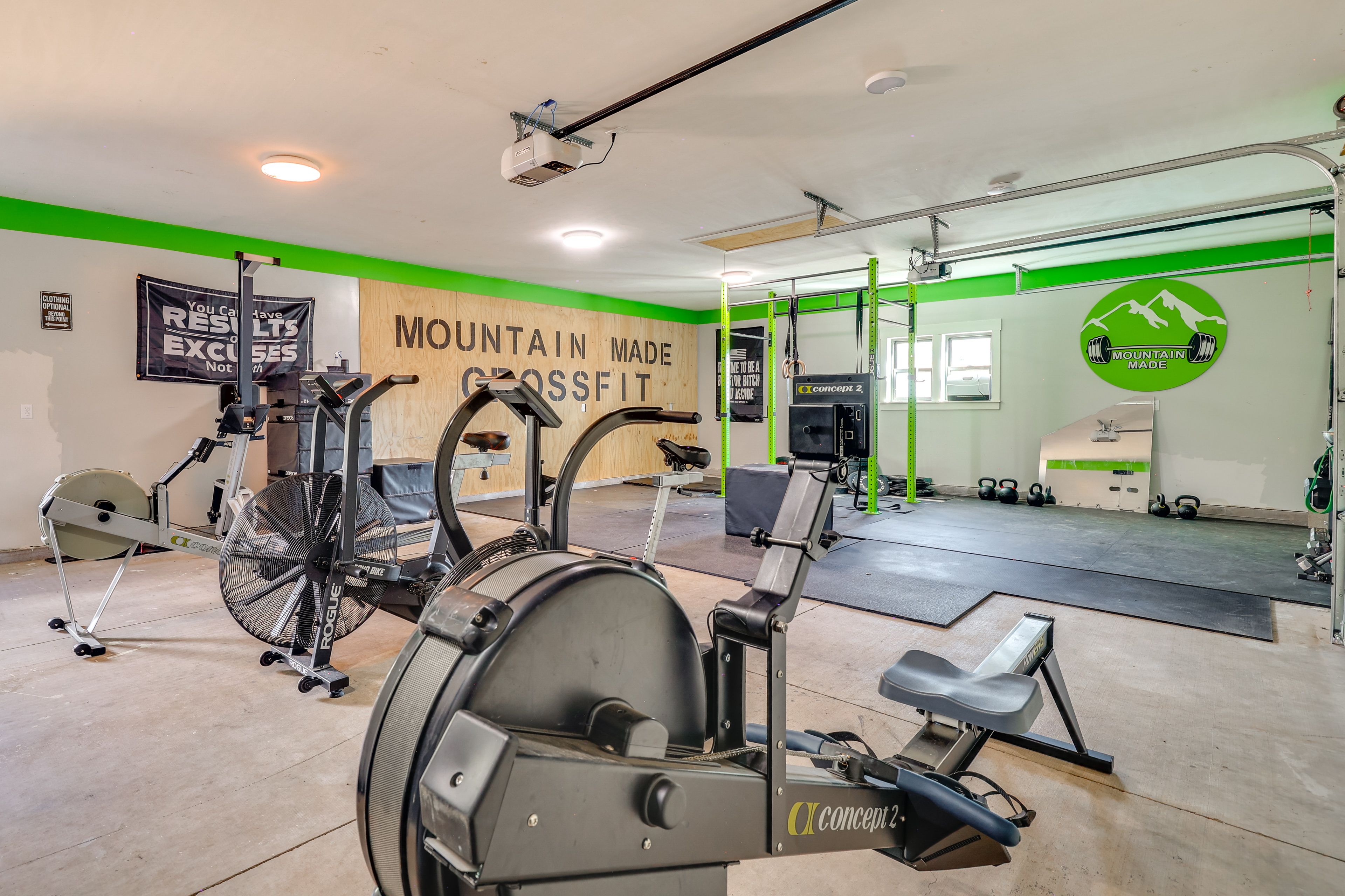 Garage Home Gym | Exercise Bikes | Weightlifting Bench | Rowing Machine