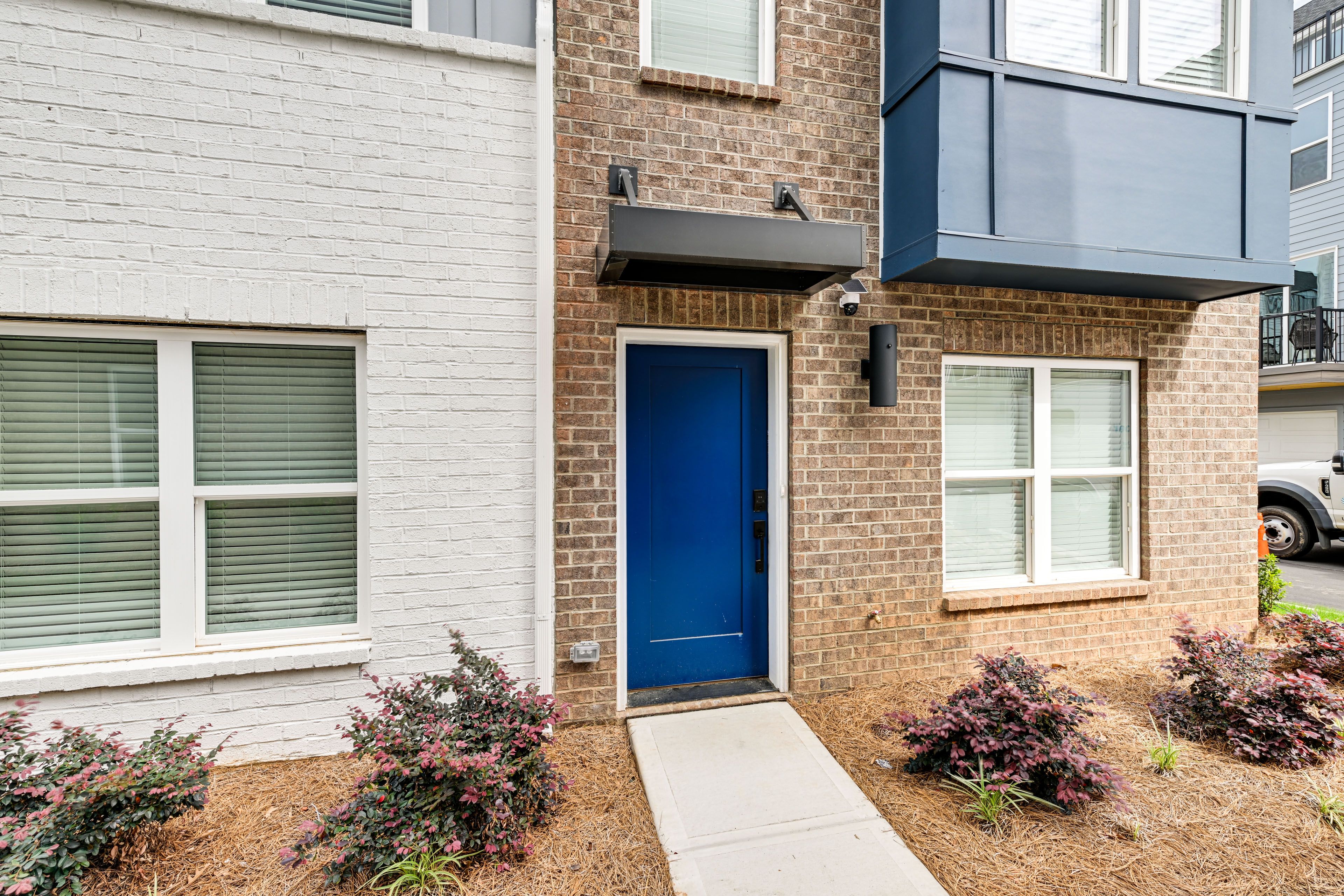 Townhome Exterior | Parking | Garage (2 Vehicles) | Free Street
