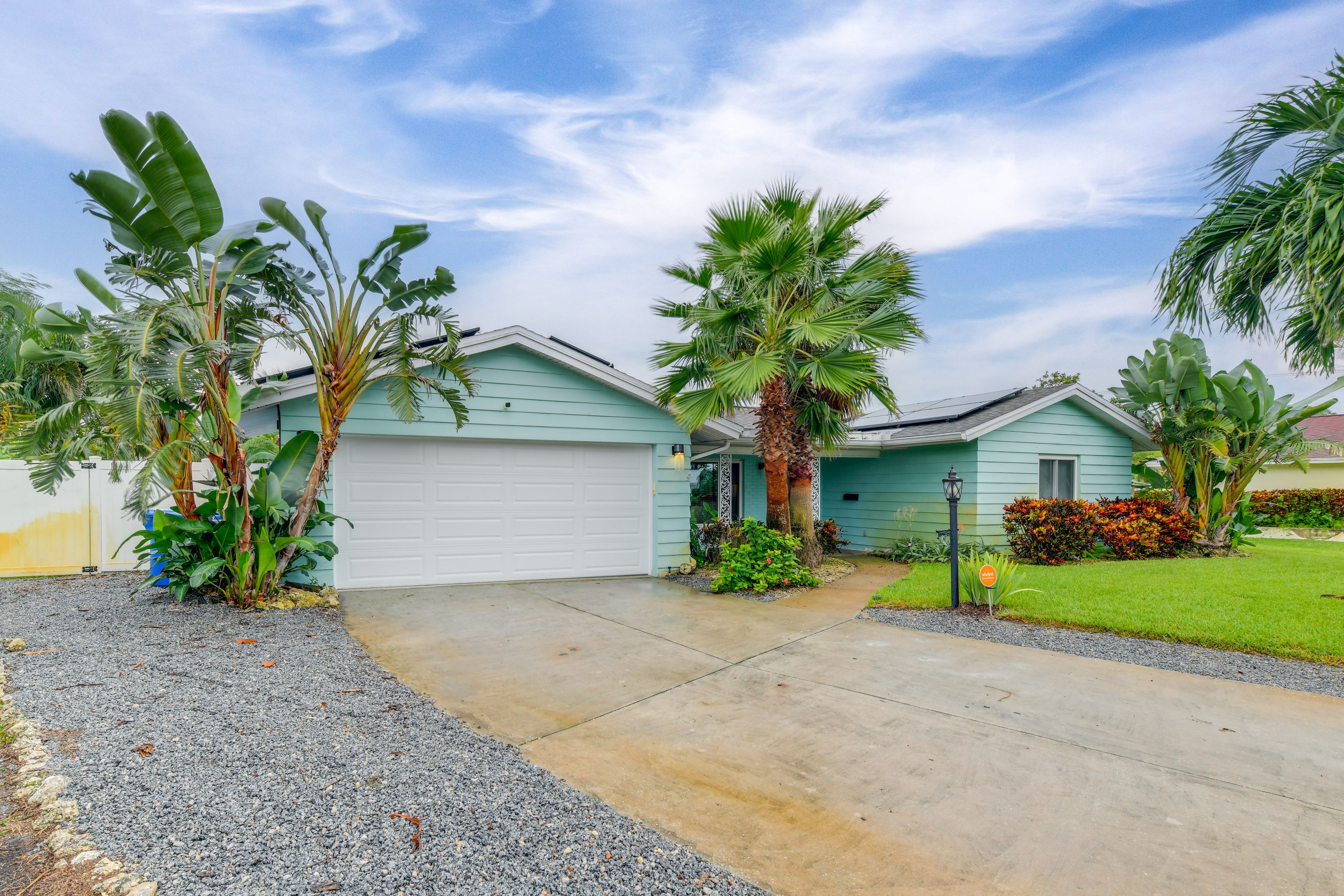 Property Exterior | Fenced-In Yard | Gas Grill & Fire Pit | Private Hot Tub
