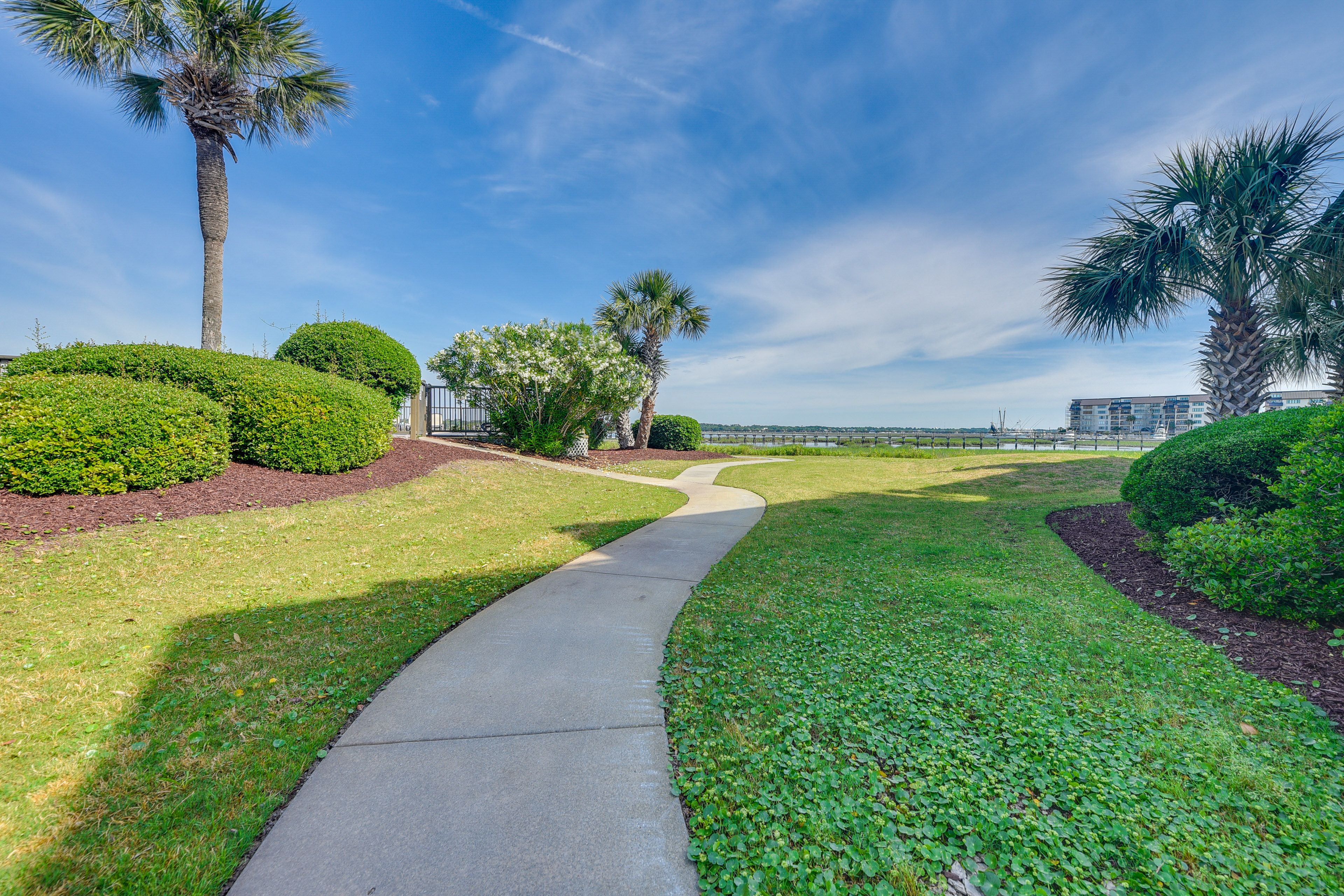 Property Exterior | Community Parking Lot (2 Vehicles, Passes Provided)