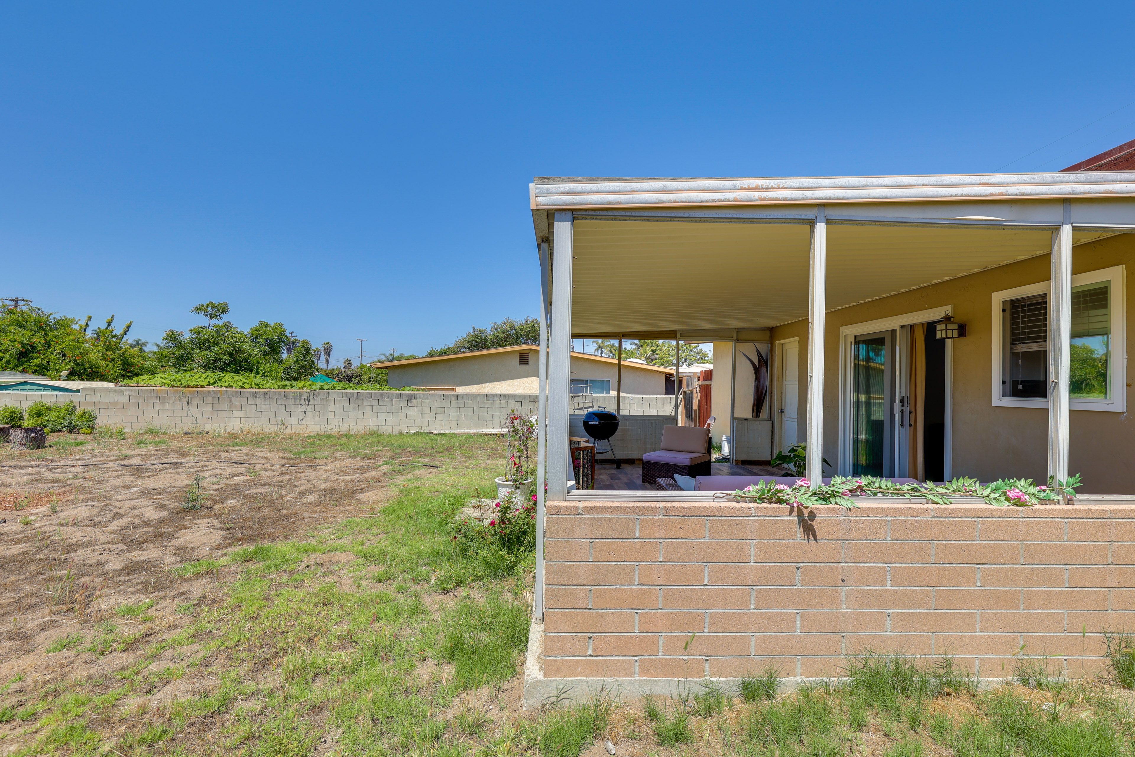 House Exterior | Fenced Backyard w/ Garden
