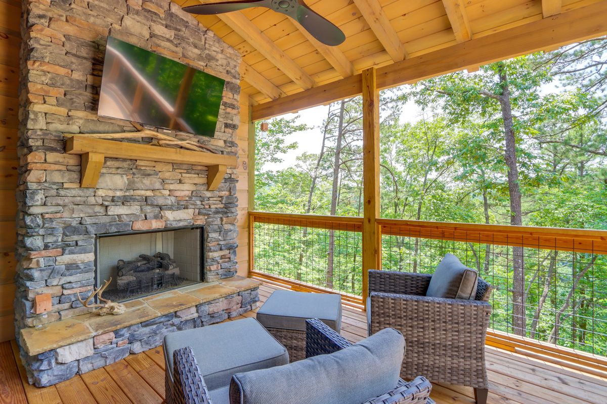 Living room with stone fireplace