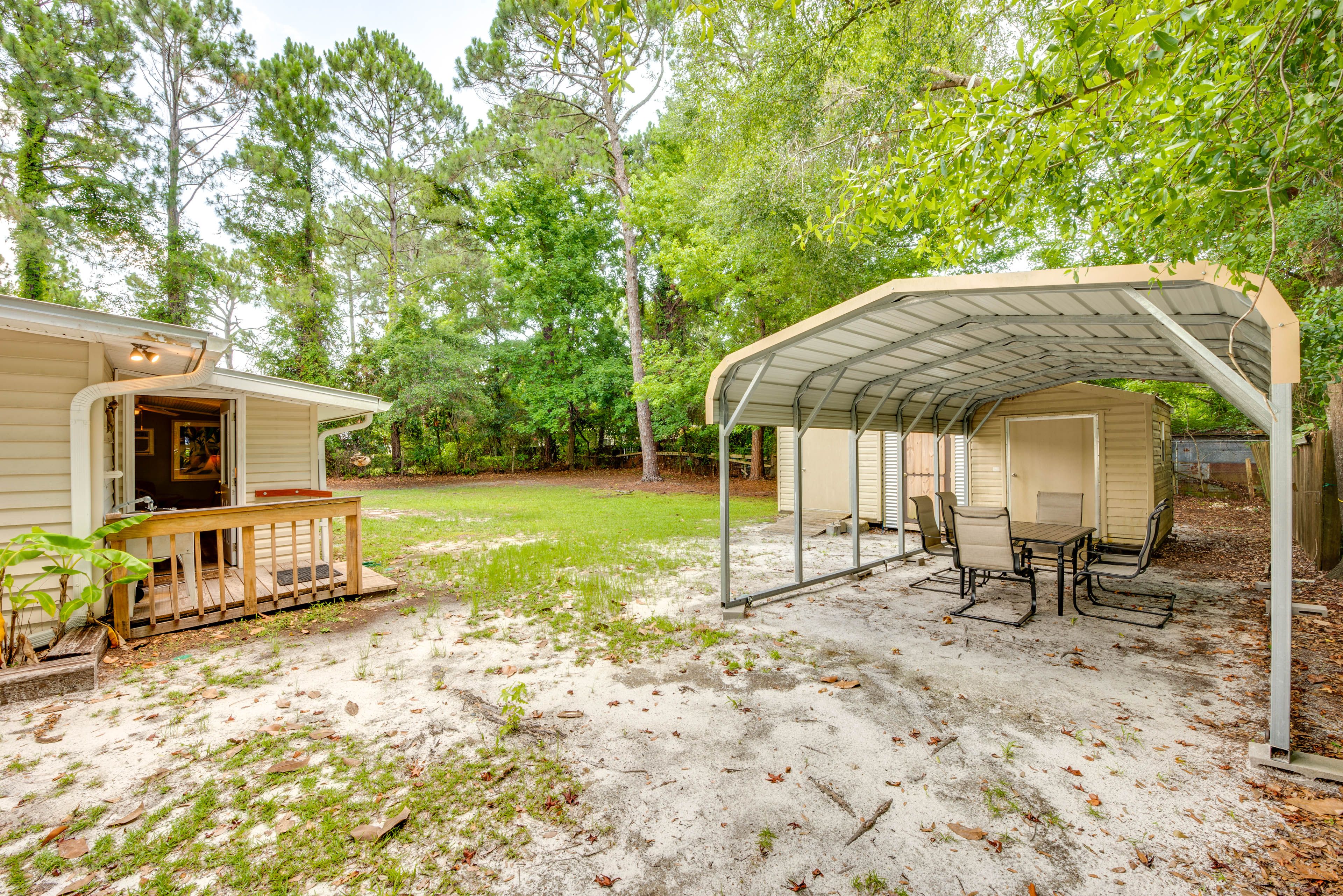 House Exterior | Covered Dining Area | Charcoal Grill | Fenced Backyard