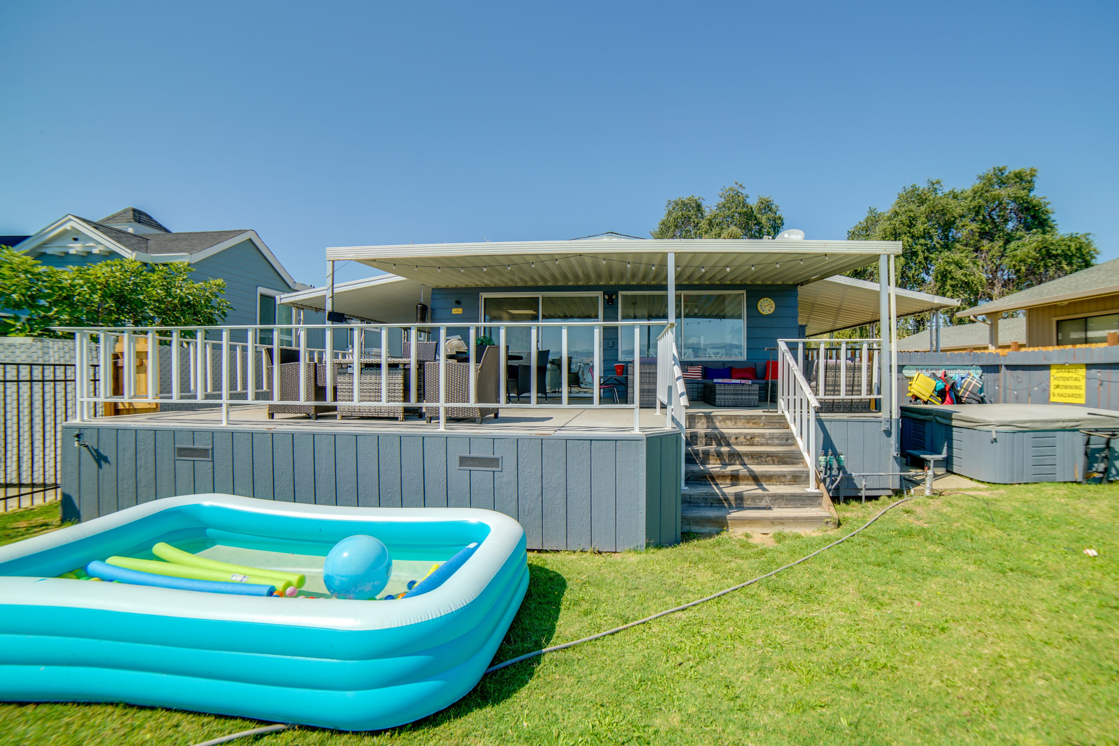 Private Backyard (Partially Fenced) | Inflatable Pool & Bounce House