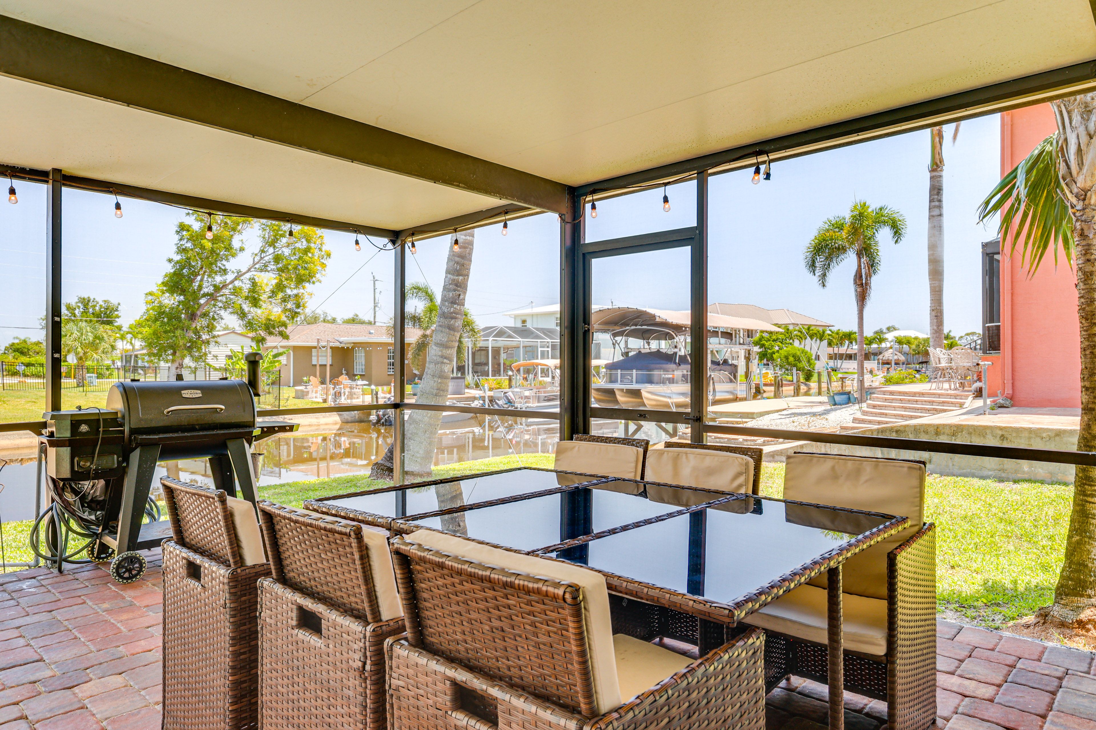 Screened-In Lanai | Pellet Grill | Dining Area | Single-Story Home