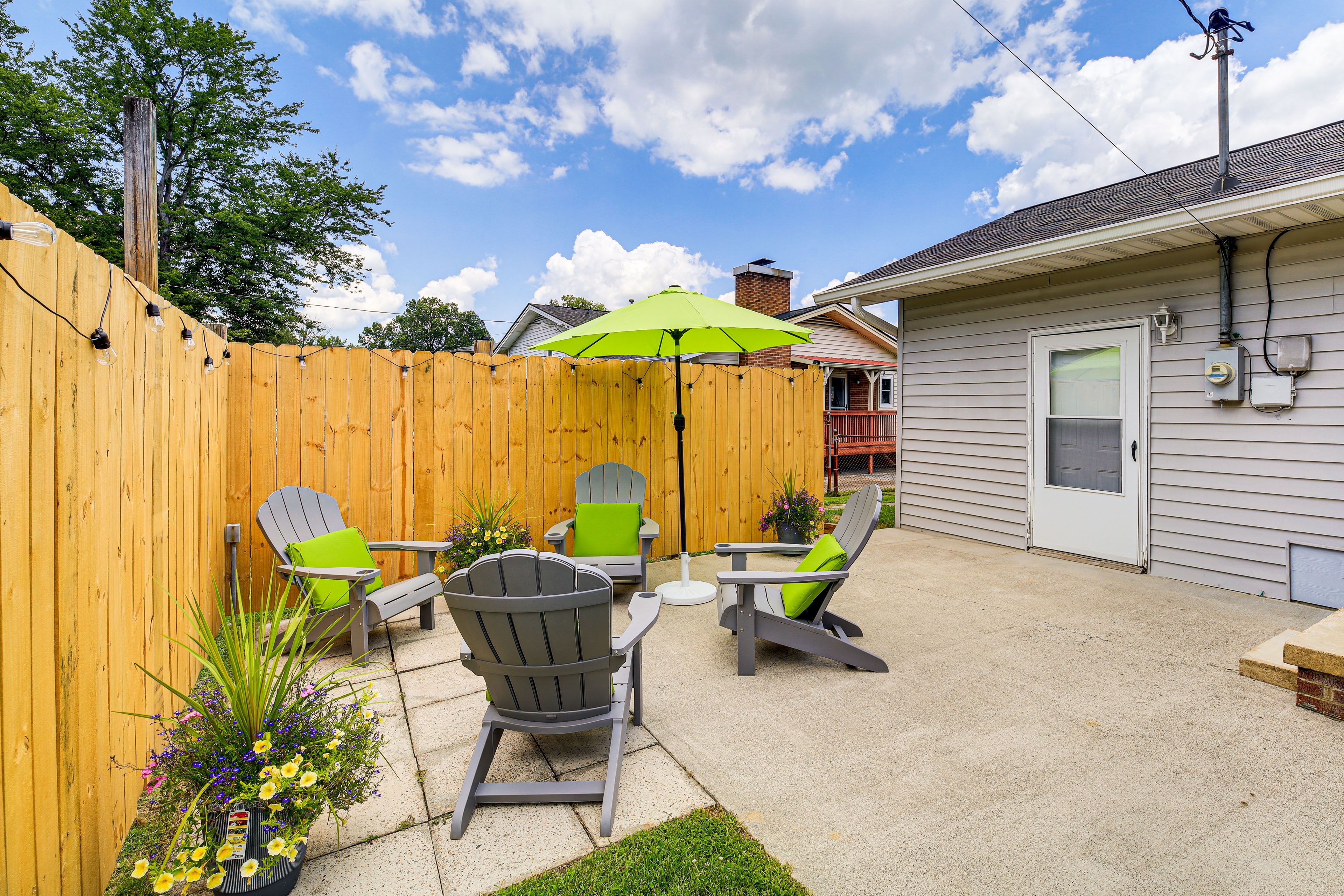 House Exterior | Furnished Patio w/ Umbrella | Fire Pit